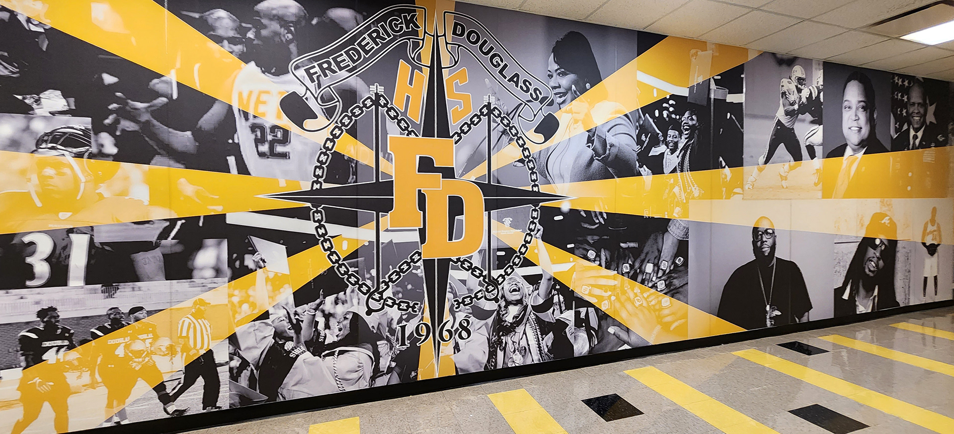 full print adhesive vinyl wall mural collage printed in black and white with yellow accent with a large four point star 'FD' logo that reads "Fredrick Douglass HS FD"