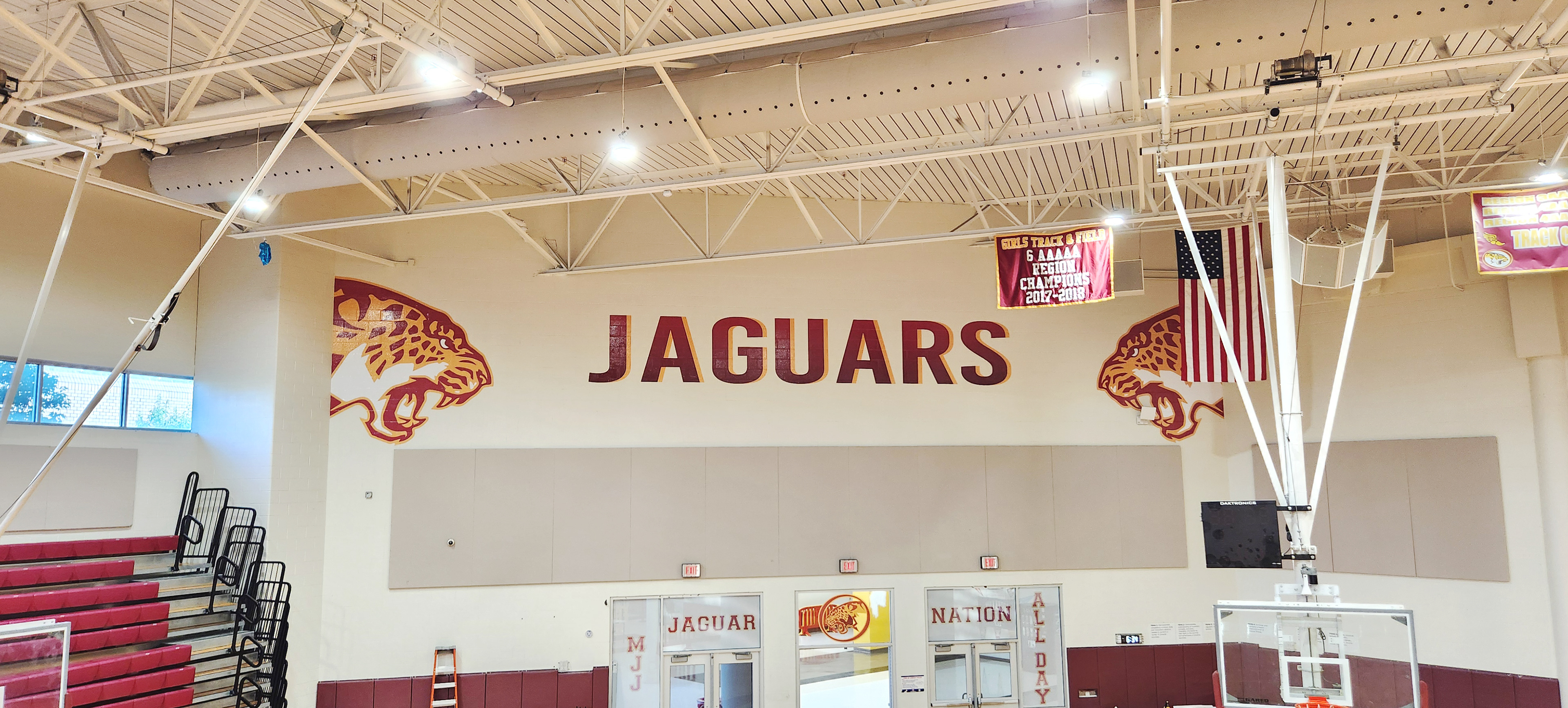 Full color print adhesive vinyl lettering reading "JAGUARS" and jaguar logos