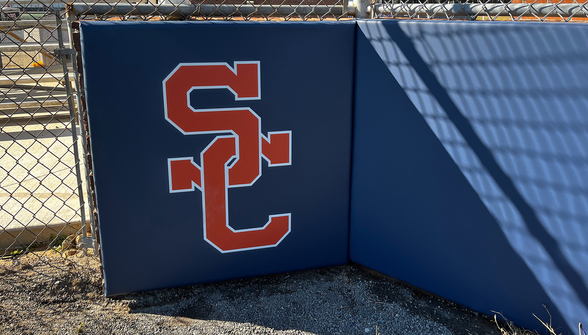Navy blue vinyl-covered padding featuring a red SC logo