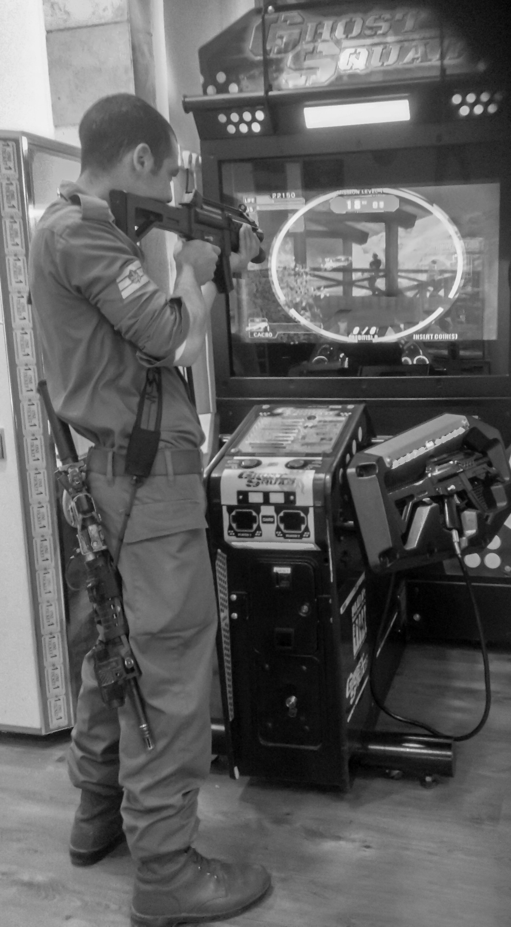 Jerusalem, Israel, December 2012. An Israeli soldier plays Ghost Squad at the Lev Talpiyot shopping centre..