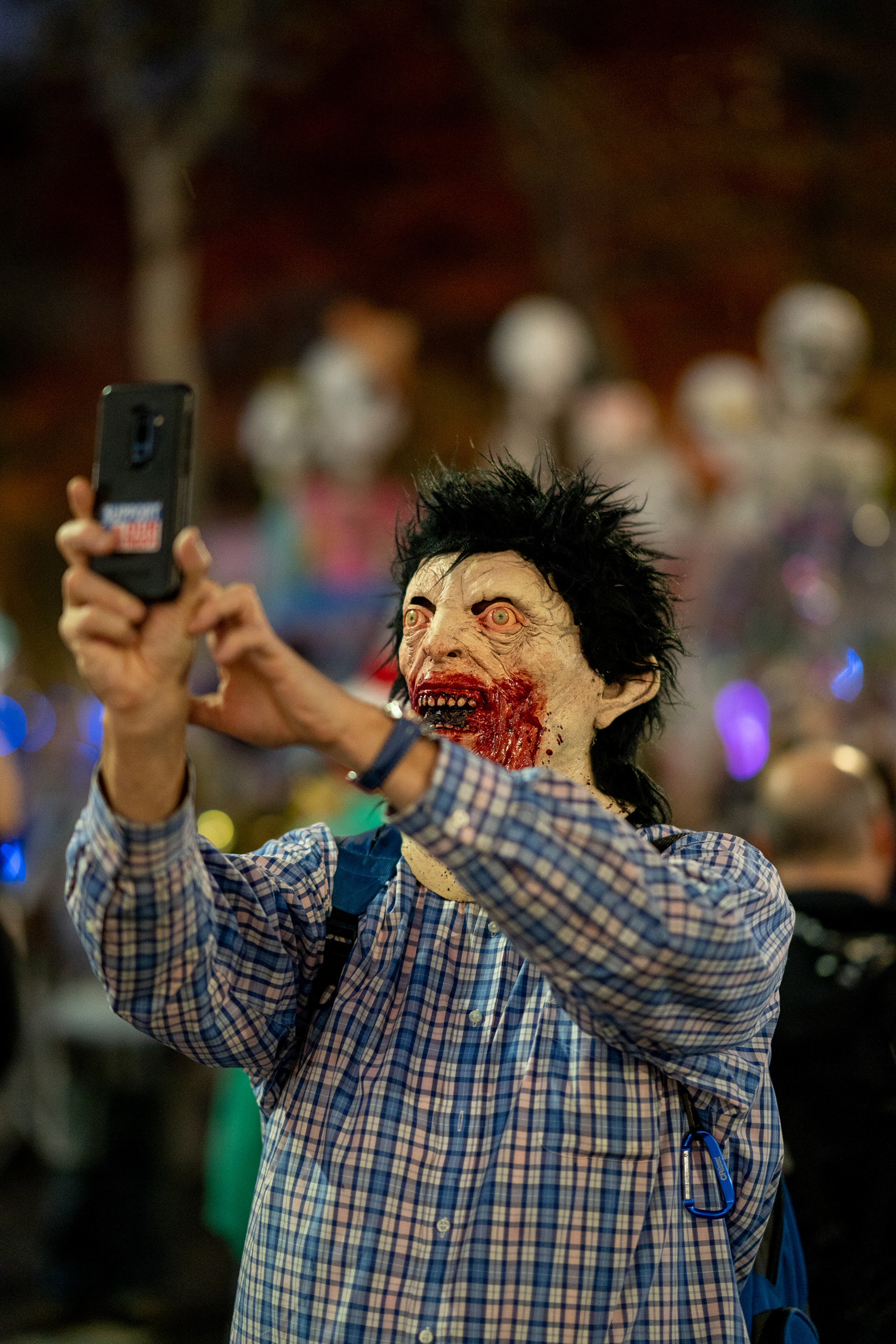Village Halloween Parade — New York, NY. October 31st, 2019. Parade participant takes a selfie before the start of the parade.