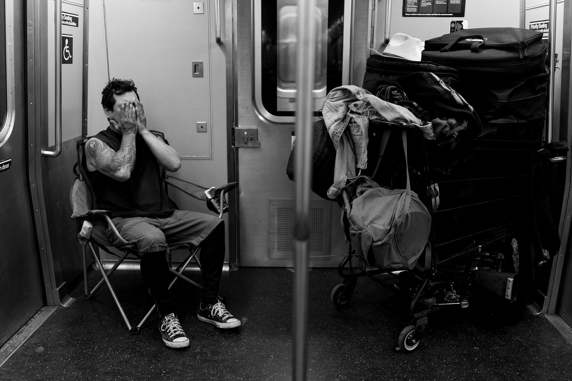 New York, NY, December 5, 2021. Jimmy Martinez with his drums on the subway back home after playing at Washington Square Park for 10 hours.