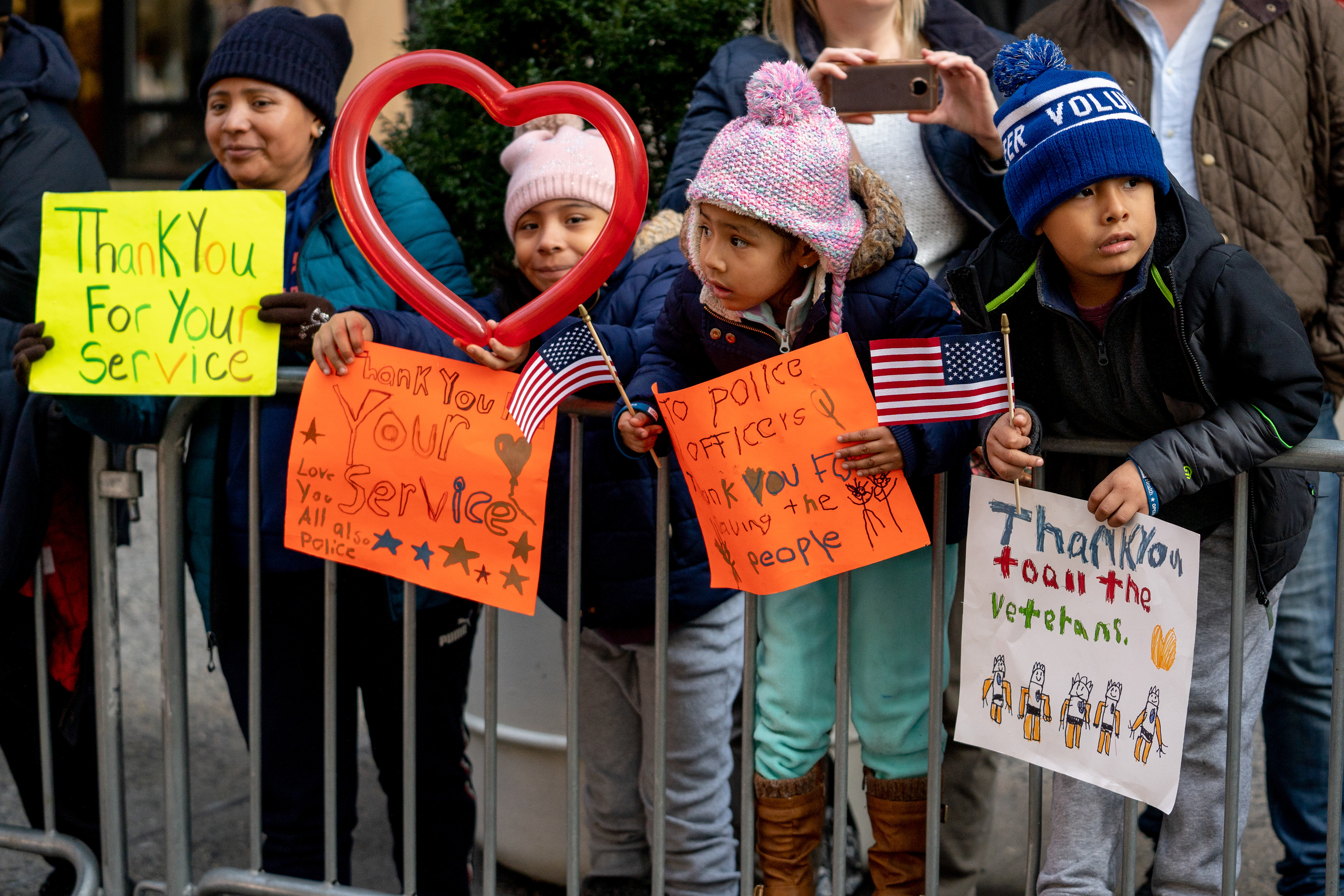 2019 Veterans Day Parade — New York, NY, 11/11/19. Children with signs they made at for the Veterans Day Parade.
