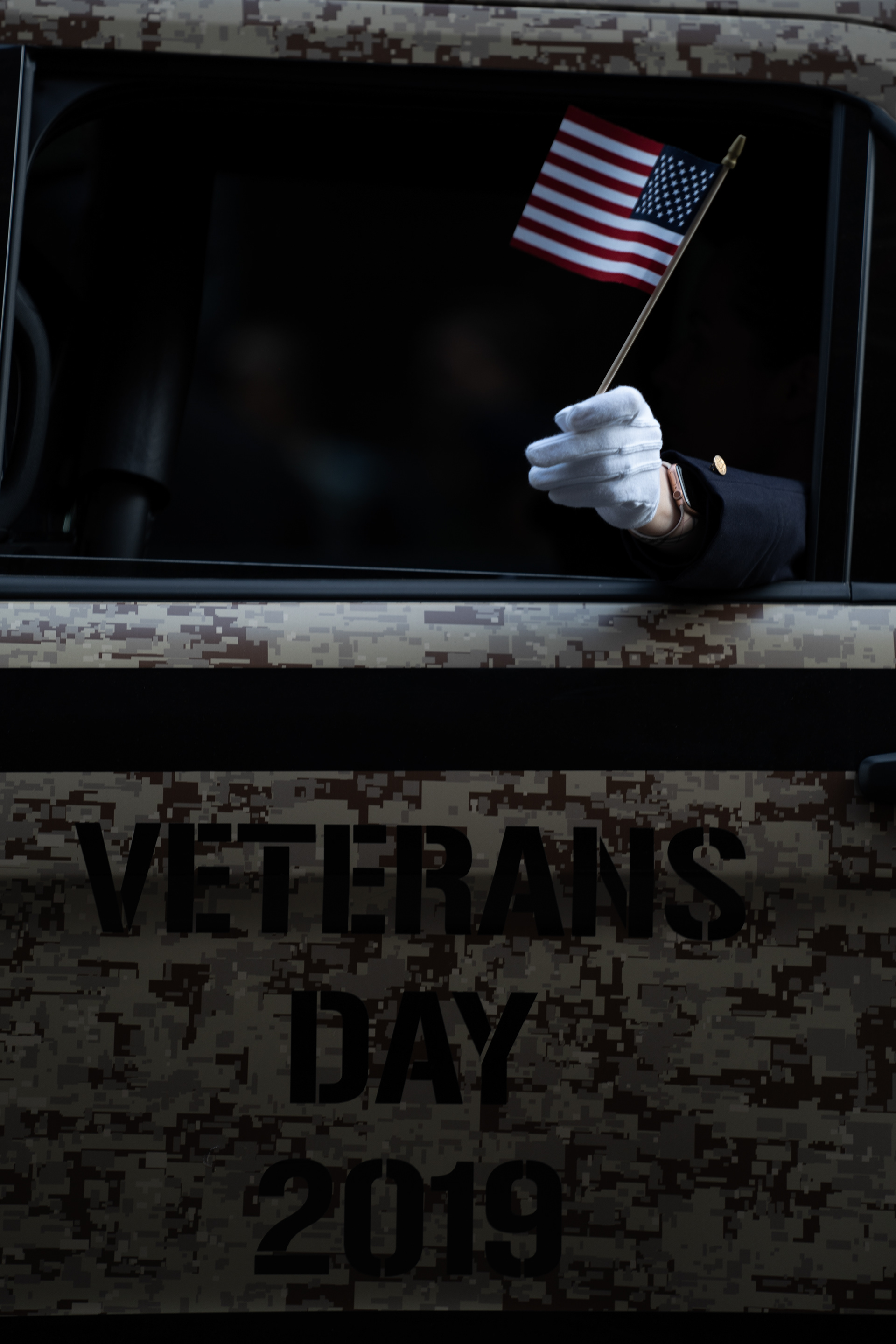 2019 Veterans Day Parade — New York, NY, 11/11/19. An officer in a police car in the parade.