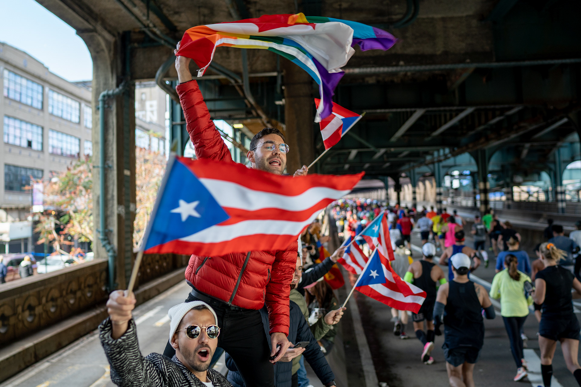 NYC Marathon — New York, NY. November 3rd, 2019. Fans (Josh and friends) cheer on their friend from the LGBTQ+ running group “Front Runners.”