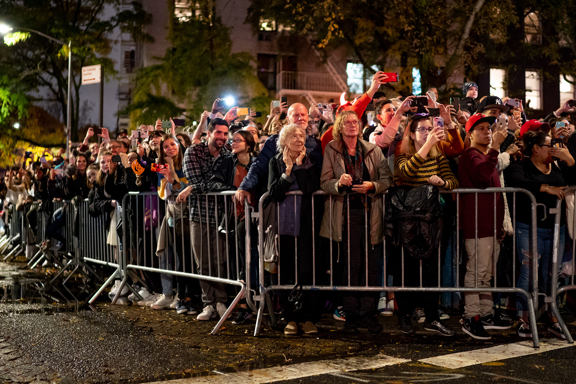 Village Halloween Parade — New York, NY. October 31st, 2019. Spectators just off of 6th Avenue.