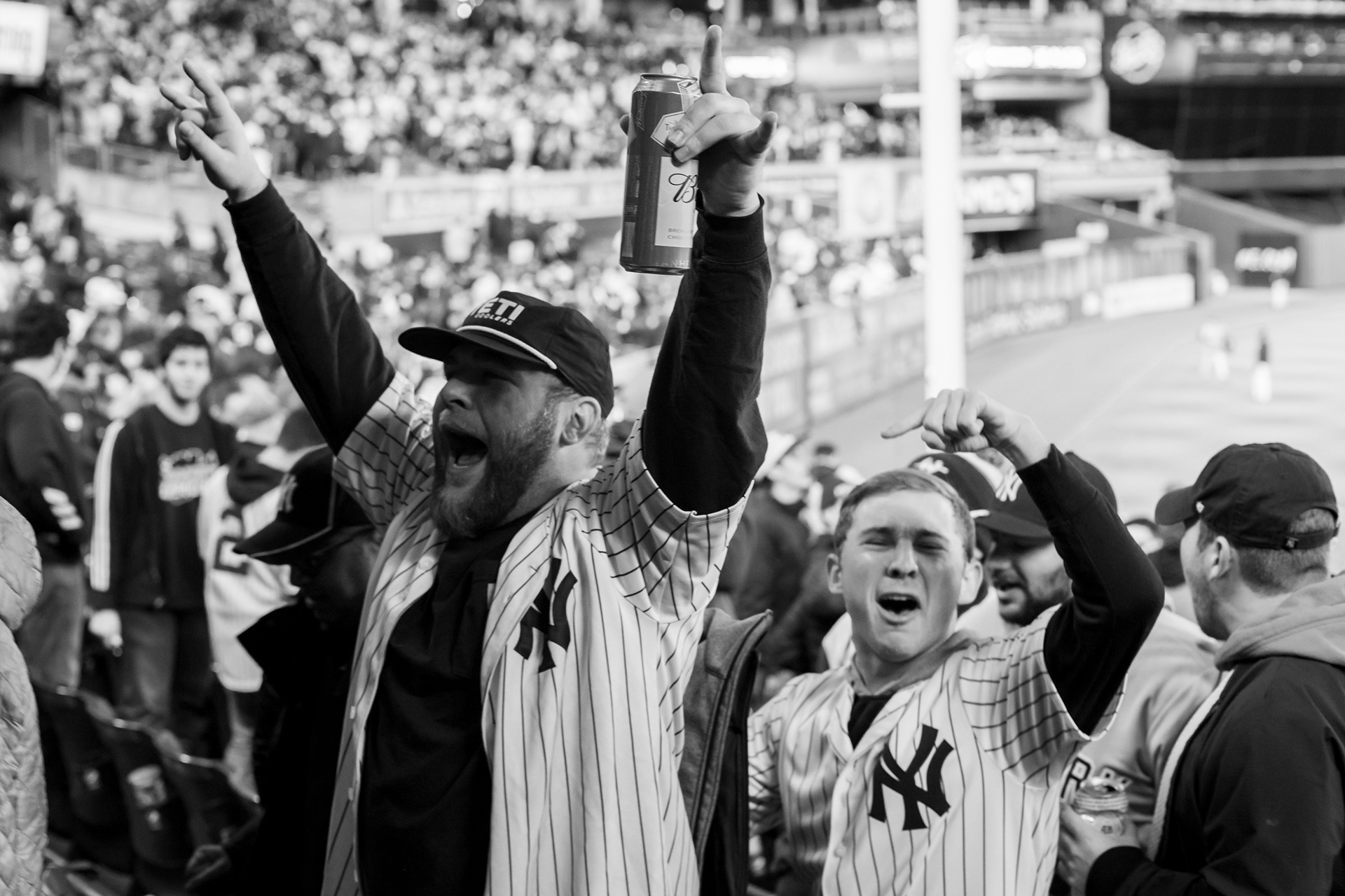 Bronx, New York — October 18th, 2019. Fans celebrate that the Yankees won.