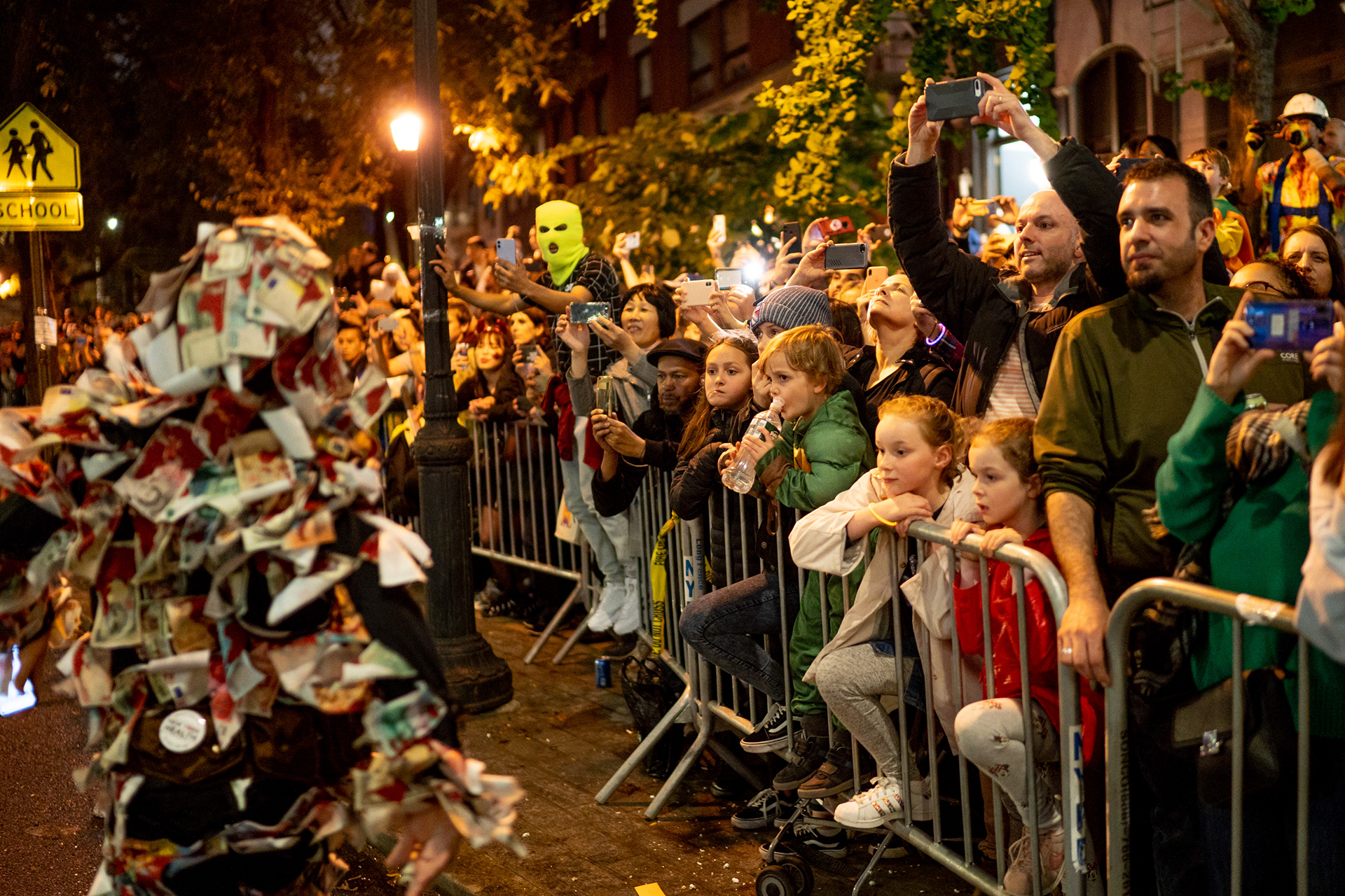 Village Halloween Parade — New York, NY. October 31st, 2019. A man in a money costume at the beginning of the parade.