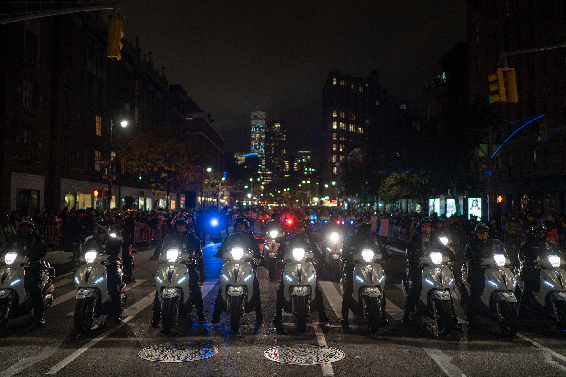 Village Halloween Parade — New York, NY. October 31st, 2019. Police scooters at the tail-end of the parade.