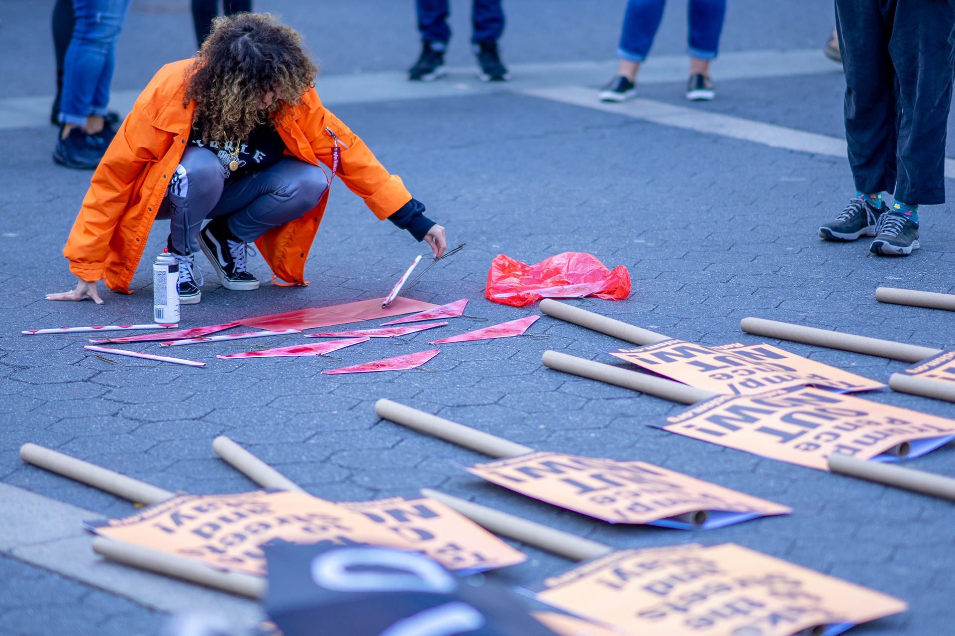 OUTNOW Protest, Union Square Park, October 19th, 2019 — Protestor colors hangers red to represent the women who will lose the right to abortion.