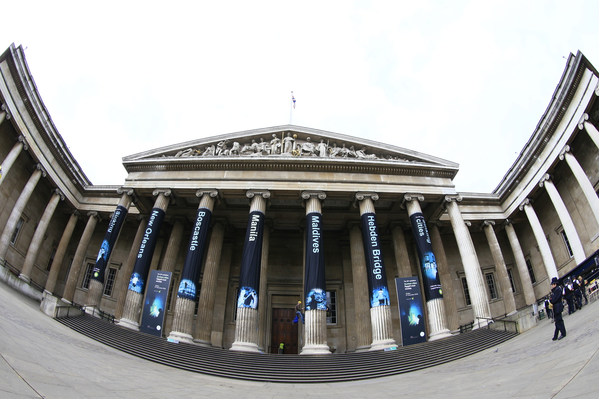 Banners hanging from pillars at the front of the British Museum in London