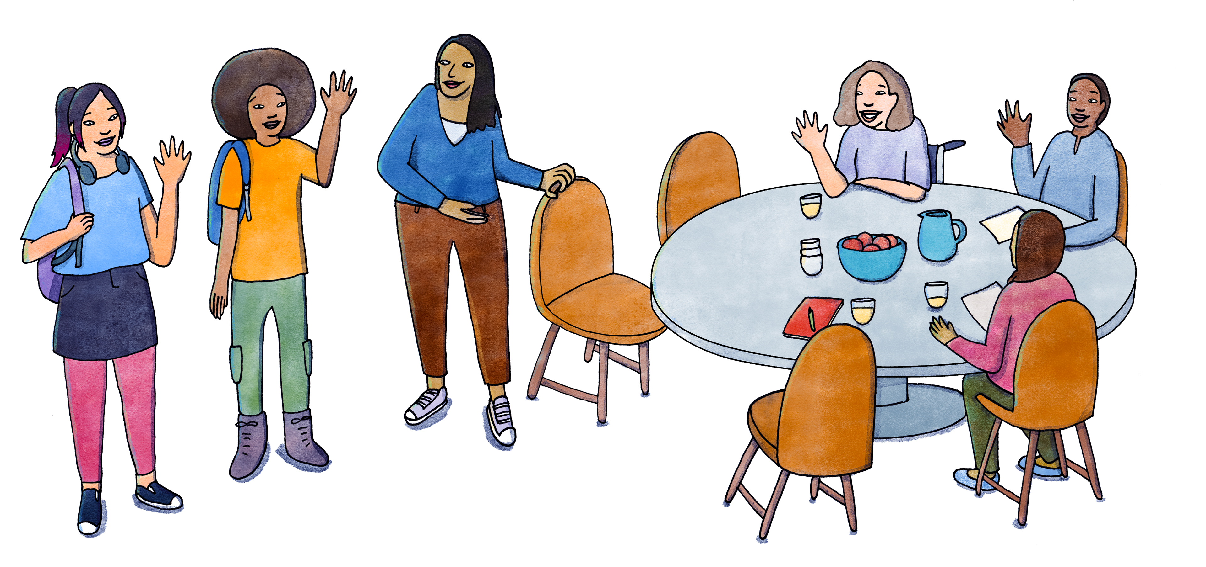 People sitting at a table, welcoming two young people who have just arrived