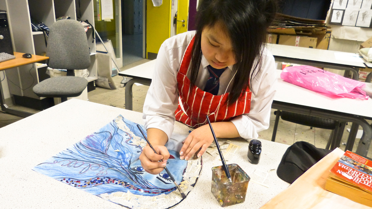 Participant painting her work