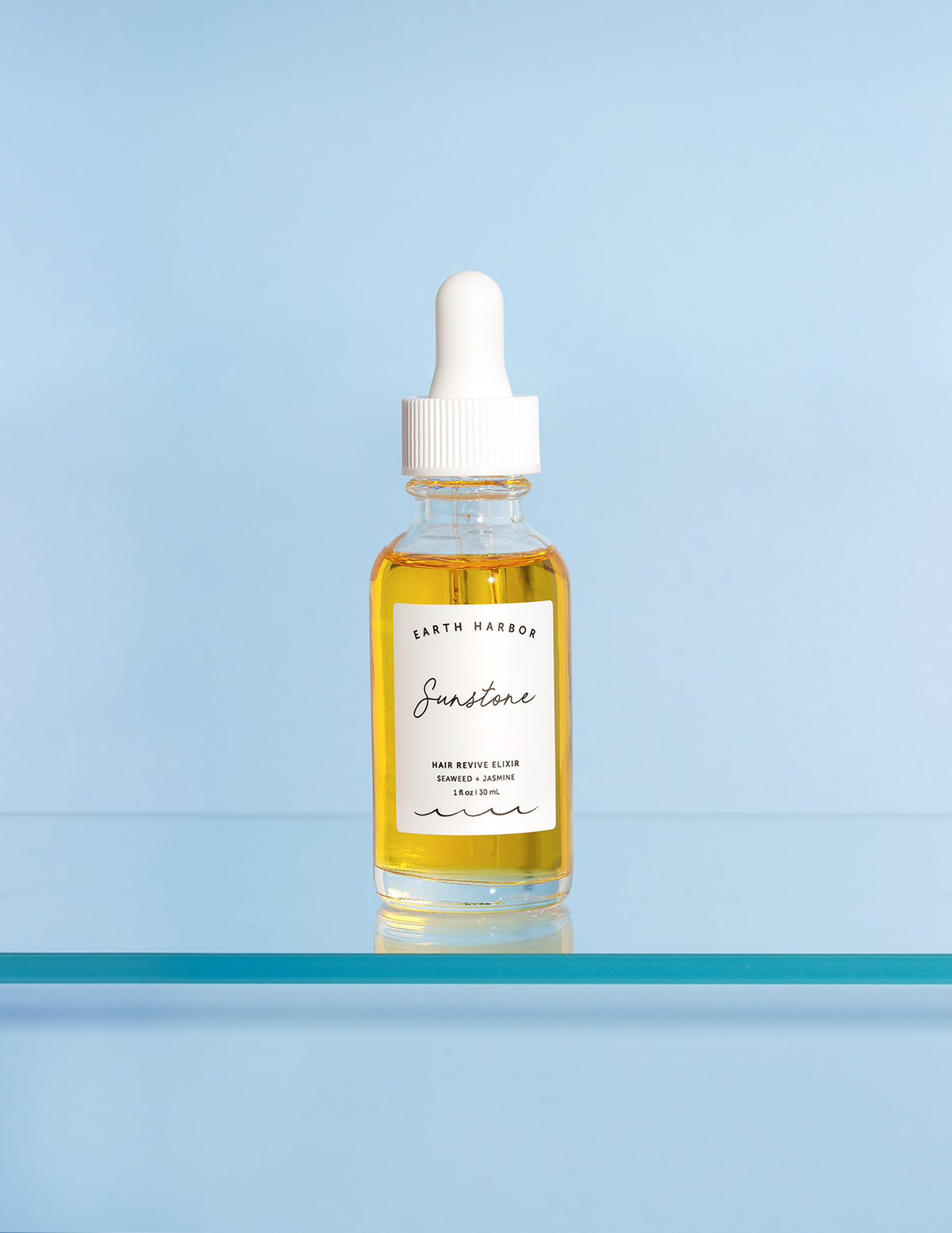 Produktfoto, hellblauer Hintergrund, Haaröl, Flasche, Glasboden, Produktfotograf, Produktfotografin