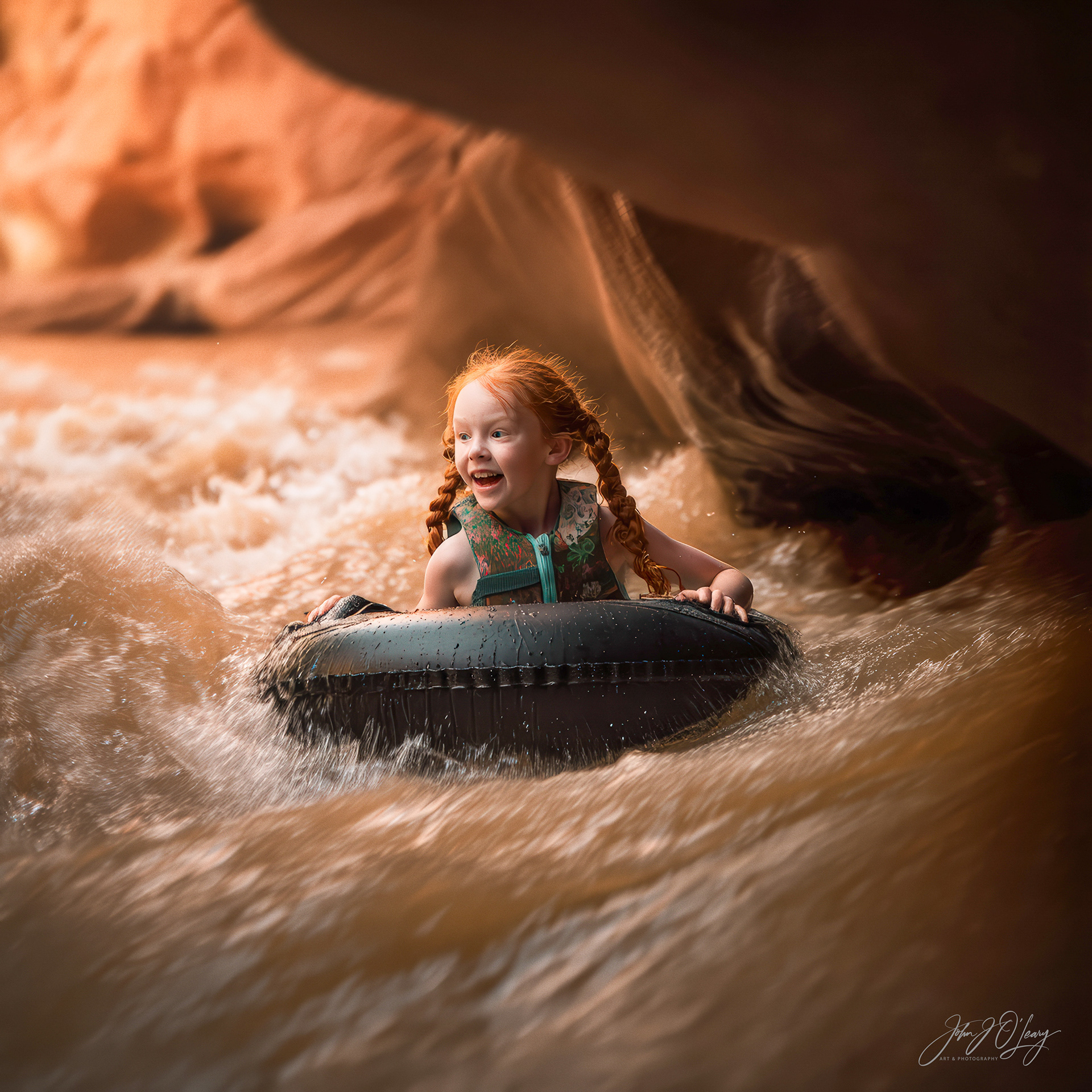 GIRL TUBING IN SLOT CANYON