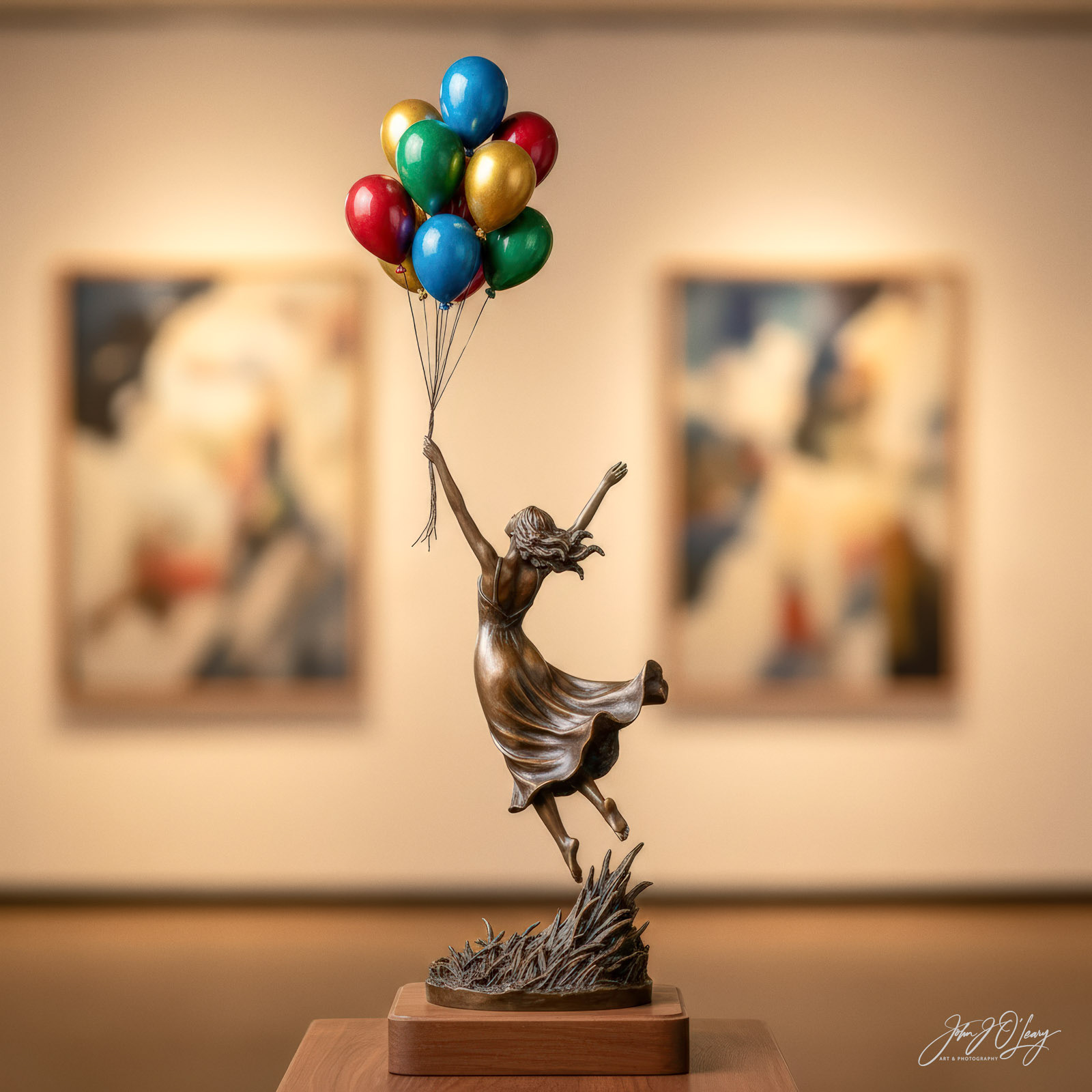 STATUE OF GIRL HOLDING BALLOONS