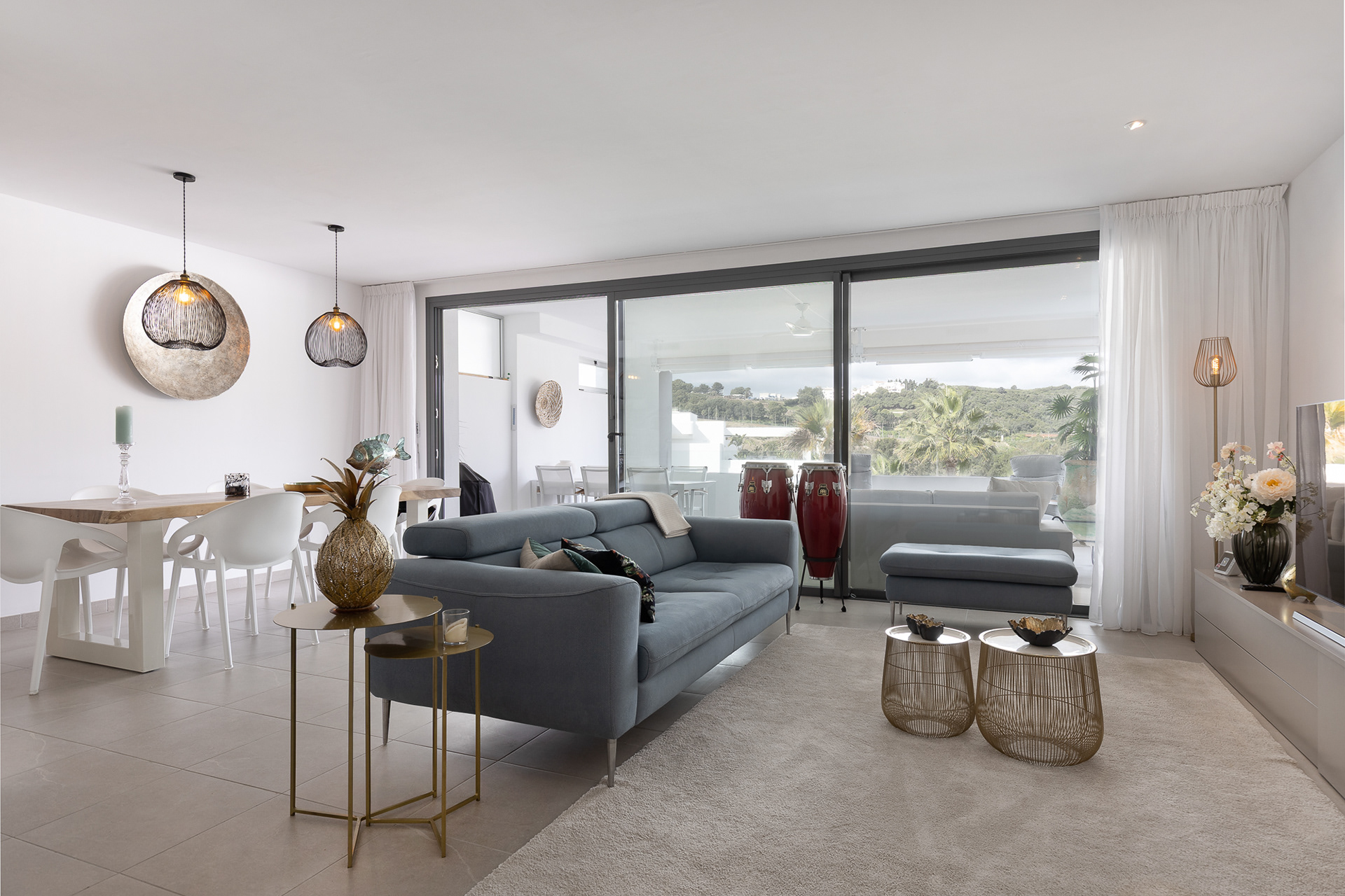Modern living room with terrace view in. Casares, on the Costa del Sol, styled for real estate marketing and property sales