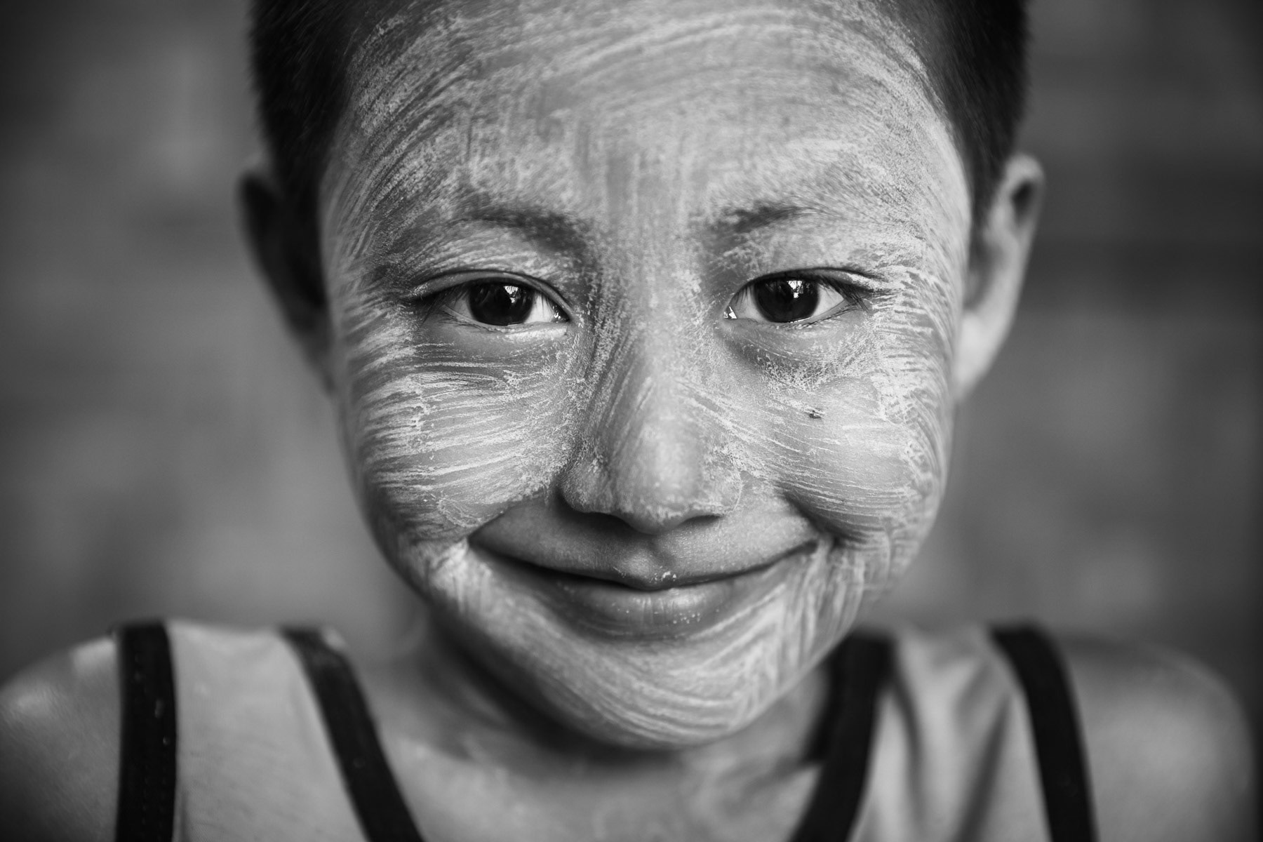 Kachin boy in a camp for internally displaced persons in Kachin State. There are more than 130 IDP camps througout Kachin hosting 100,000 displaced persons. Mahong IDP camp in Mogaung, Myanmar, September 2019