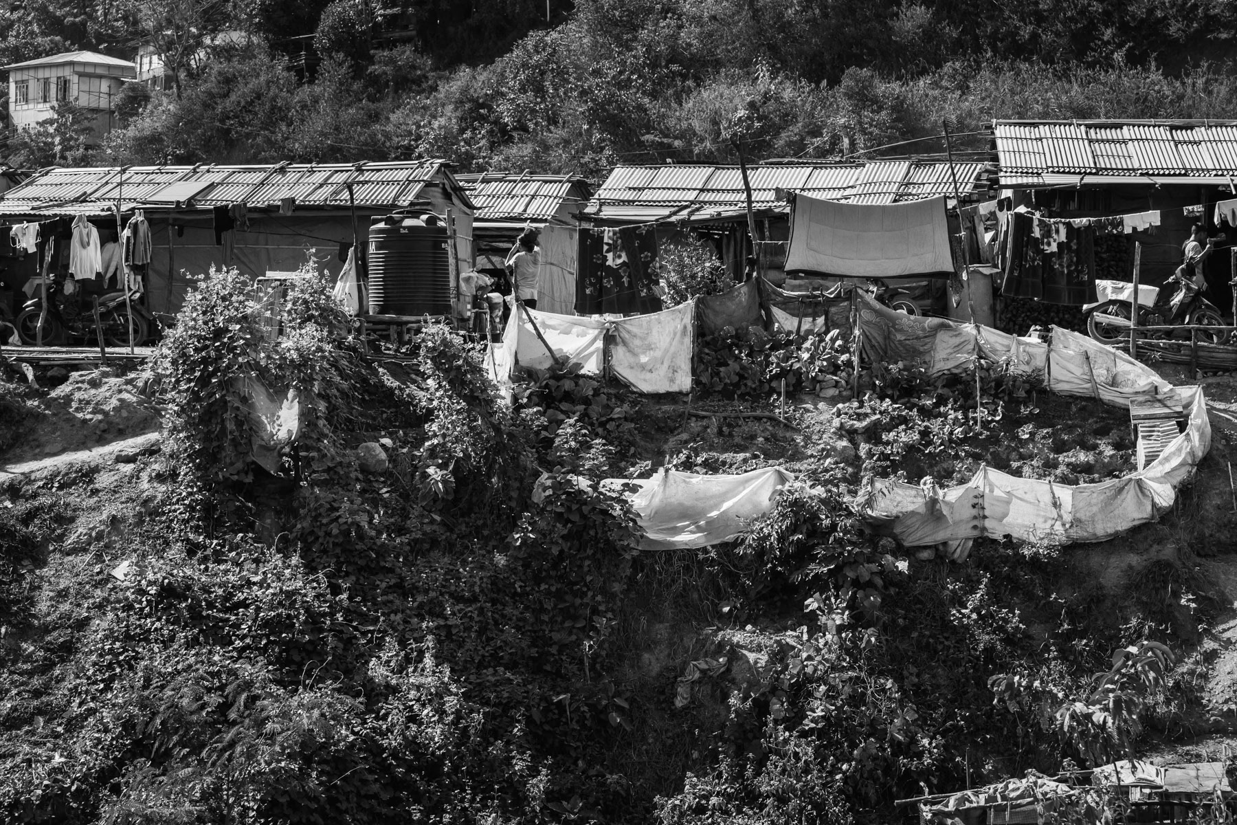 Chin refugee camp near the town of Zokhawthar on the Burmese border. The area is prone to landslides and the camp with its 225 refugees will have to be relocated soon. Mizoram, India, November 2022