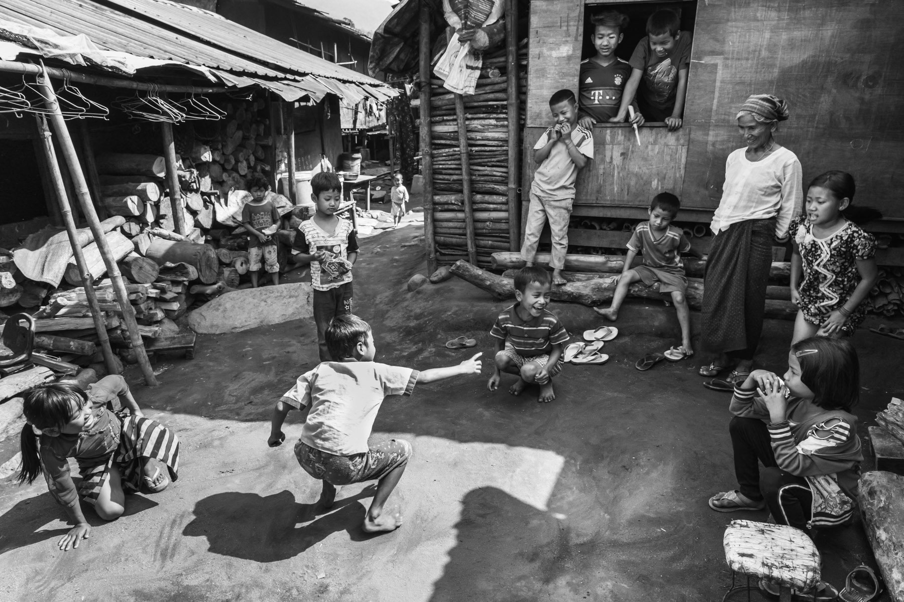 Kachin children playing in an IDP camp along the border with China in Kachin Independence Army (KIA) held territory in Myanmar. More than 8700 displaced Kachin live in Je Yang camp one hour south of Laiza, the stronghold of the KIA. Je Yang camp in Laiza Township, Myanmar, April 2019