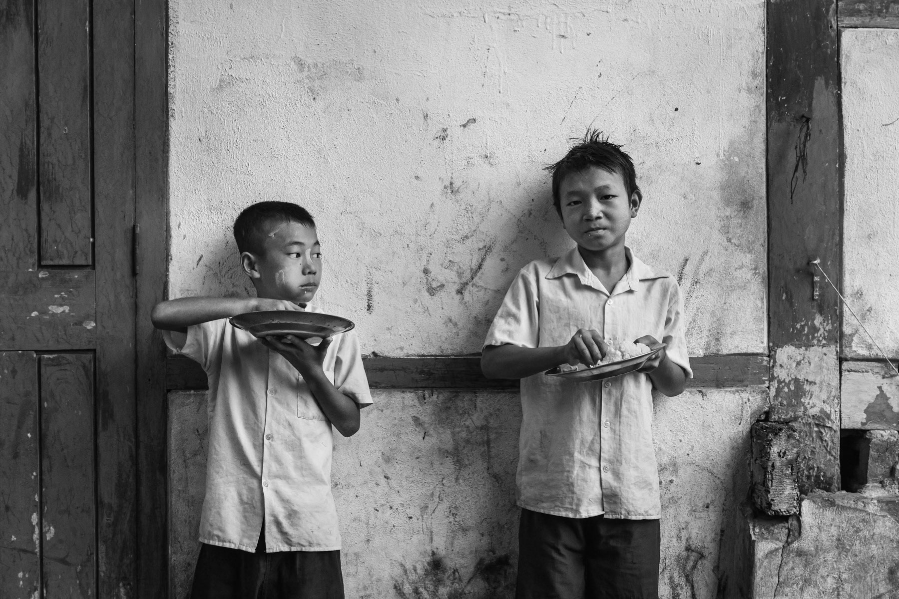 Kachin internal displaced persons living among 400 people on a very small piece of land since 2018 when they fled their village only 25 Km away. Over 100,000 Kachin are displaced within the Kachin State since the armed conflict resumed in 2011 between the Myanmar military and the Kachin Independence Army (KIA). St-Paul IDP camp, Namta, Myanmar, September 2019