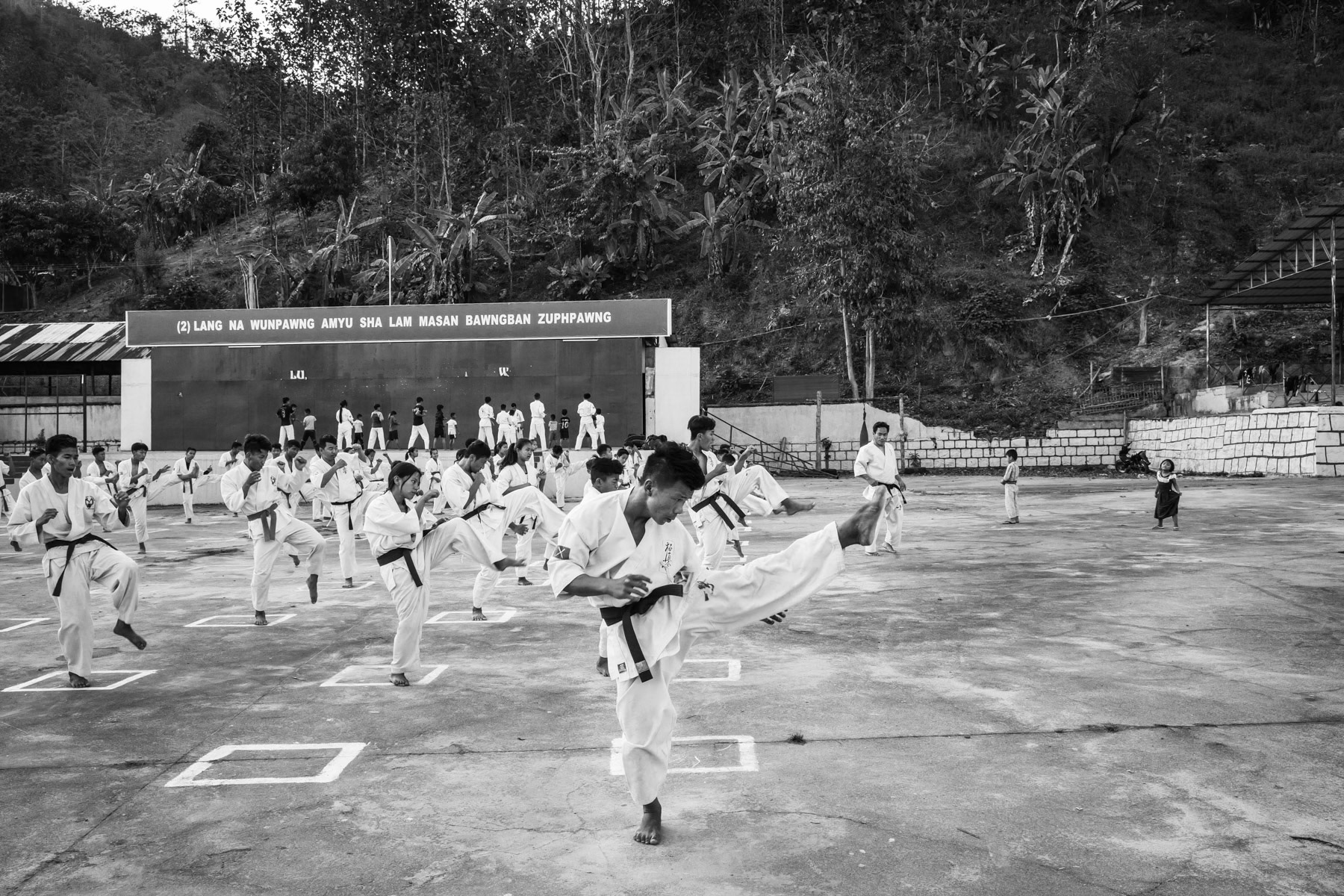 Kachin youth practising martial arts part daily self defense and sports activities. Laiza, the stronghold of the Kachin Independence Organisation controlled territory along the Chinese border. Laiza, Myanmar, April 2019