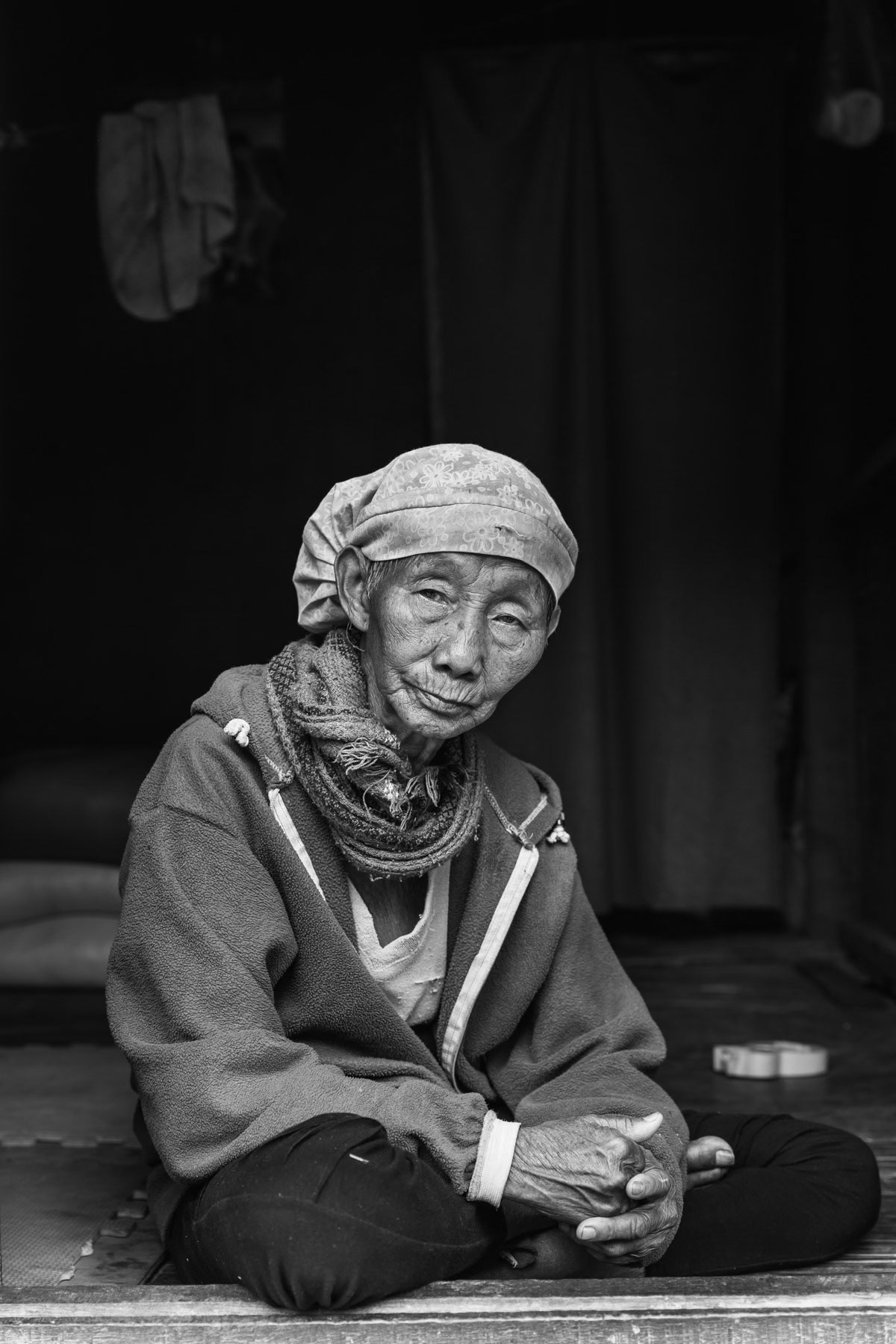 A Kachin elderly woman in her shelter in Dum Bung camp for internally displaced persons. This IDP camp has 380 residents and is located in a remote area at least 2 hour drive to the first town with medical facilities. Mai Ja Yang district in KIA controlled territory, Kachin, Myanmar, April 2019