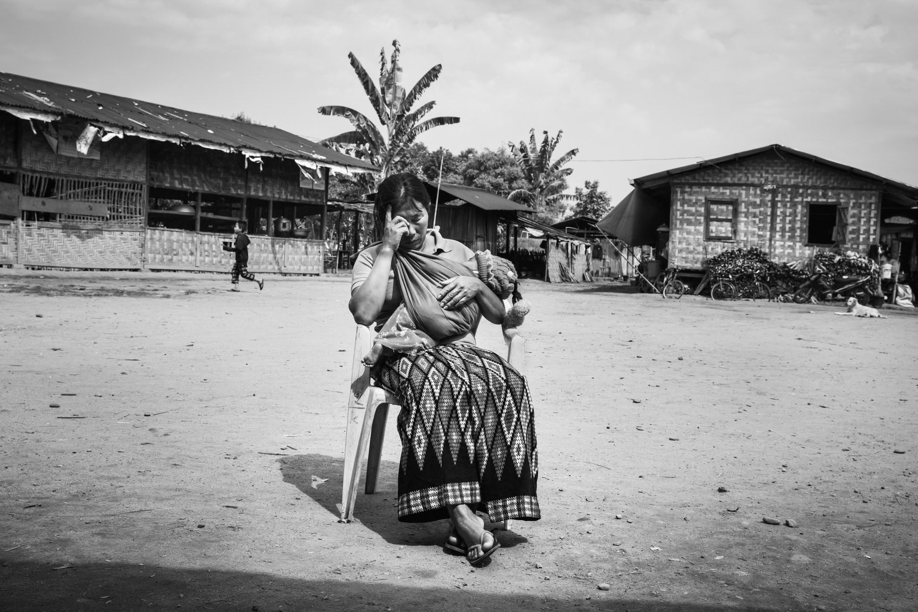 Kachin woman and child in a camp for internally displaced persons in Kachin State. There are more than 130 IDP camps througout Kachin hosting 100,000 displaced persons. Jan Mai Kuang IDP camp near Myitkyina, Myanmar, March 2019