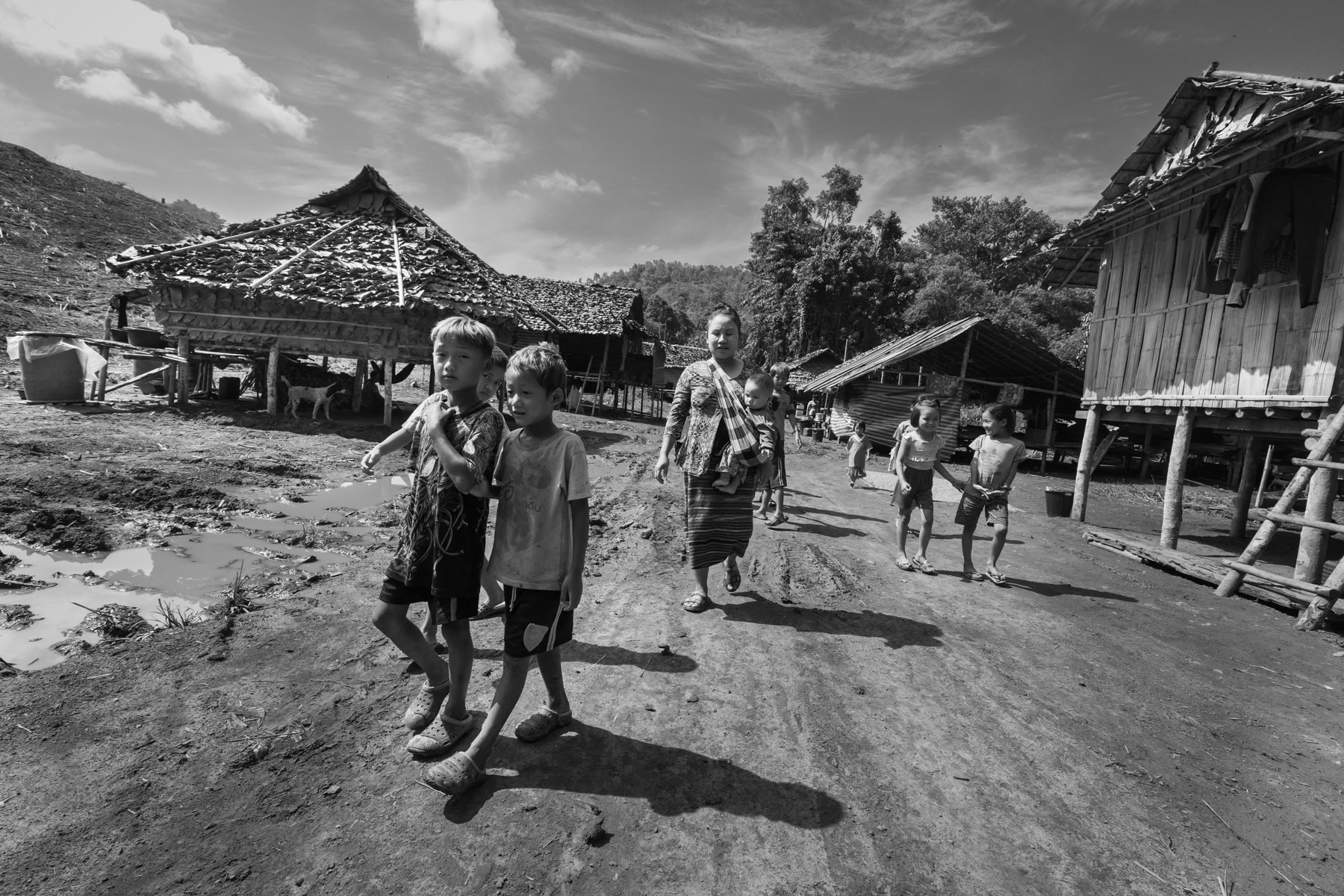 Karen displaced persons in a camp near the Thai border in territory controlled by the Karen National Liberation Army (KNLA). They have fled their villages after repeated air attacks by the Myanmar military. Widwspread terror and attacks against civilians and ethnic minorities have substantially increased since the military coup in 2021, provoking large numbers of displaced persons and refugees. Kanele IDP camp, Way Lay, Kayin State, Myanmar. June 2022