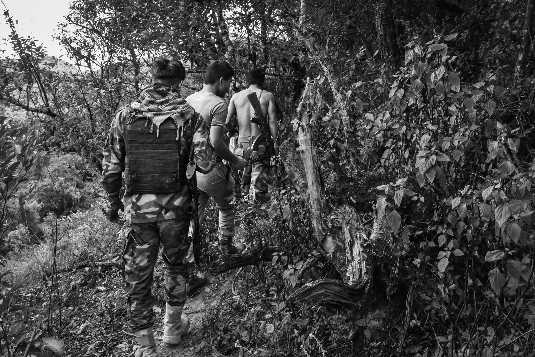 Chin National Defence Forces on a frontline facing a Myanmar military base in the mountains of Falam Township in Chin State. Since the military coup in Myanmar, people have taken up arms throughout the country to resist and defend themselves against atrocities committed by Tatmadaw, the Myanmar military who supressed civilian rule in February 2021. CNDF Frontline, Myanmar, November 2022