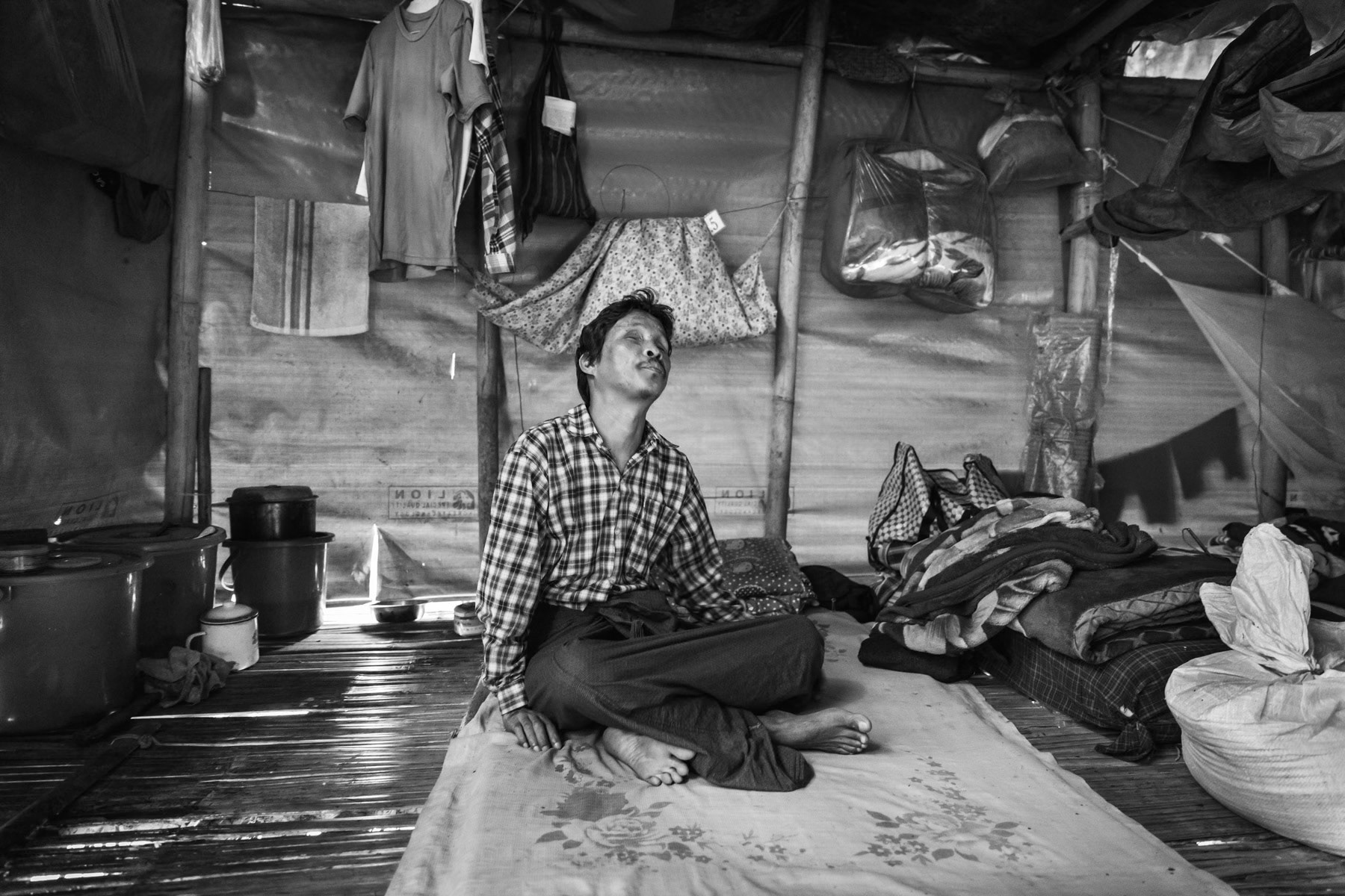 Blind man, 48y, was hit by shrapnel while laying mines for KIA in 2012. Was severly injured at the arm and eyes and is blind ever since. Lived in Zup Mai until 2018 from where he was displaced when fighting broke out. Myo Oo IDP camp, Namta, Kachin State, Myanmar, September 2019