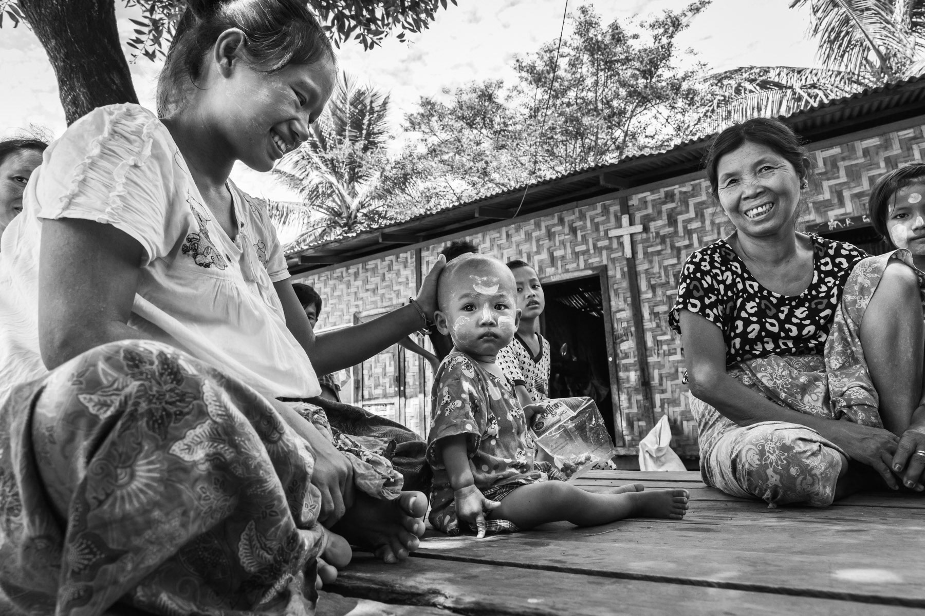 Kachin IDP in front of their shelter. All IDP camps in government controlled territory have been set up on land owned by local Christian churches as government land was not made available. The majority of Kachin follow the Christian faith. Nat Kyi Koong IDP Camp, Mogaung, Kachin, Myanmar, September 2019