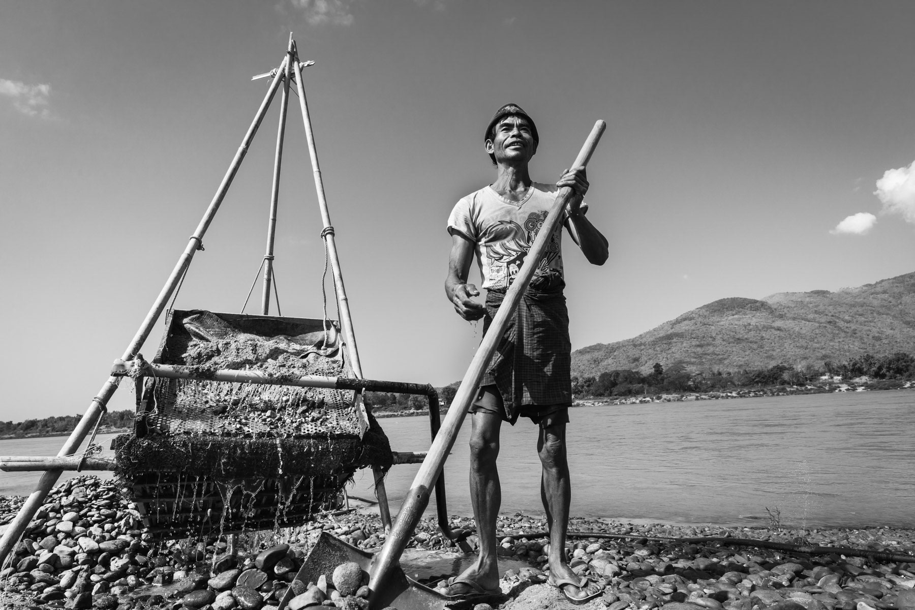 A local Kachin villager searching for gold along the Irrawaddy river north of Myitkyina in Kachin State, Myanmar, March 2019