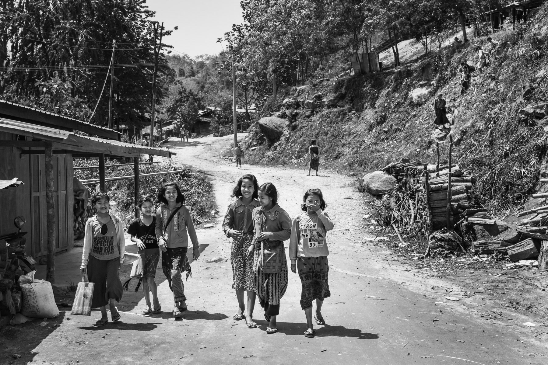 Kachin children after school in Je Yang IDP camp in Kachin Independence Army controlled territory. The KIA territory is landlocked between China and the frontline making it extremely difficult for humanitarian aid and food to reach this remote conflict zone in Northeastern Myanmar. Je Yang, Laiza, Myanmar, April 2019