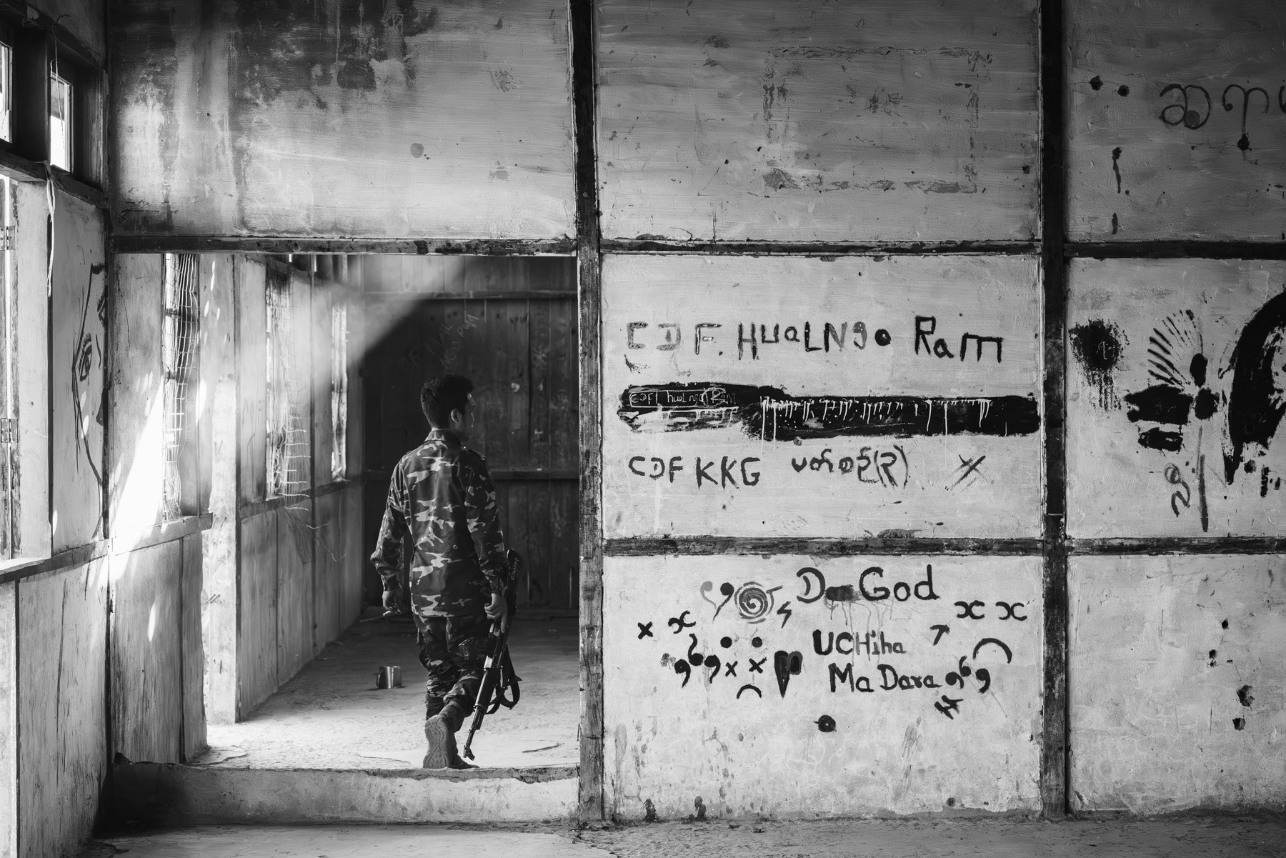 Member of the Chin Defense Forces at the frontline in a school facing the Myanmar military positions. The town has been emptied of its civilian population and is since then bitterly fought over. At this stage both sides control more or less 50% of Thantlang. Thantlang school building, Chin State, Myanmar, April 2024
