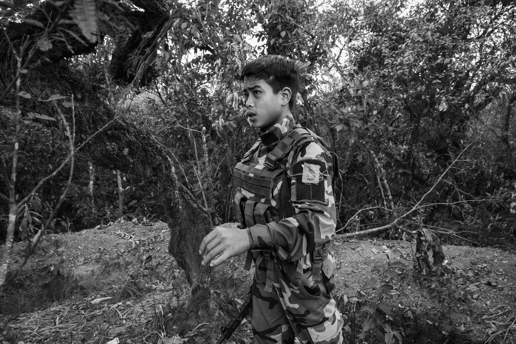 Chin National Defence Force at a frontline facing a Myanmar military base in the mountains of Falam Township in Chin State. Since the military coup in Myanmar, people have taken up arms throughout the country to resist and defend themselves against atrocities committed by Tatmadaw, the Myanmar military who supressed civilian rule in February 2021. CNDF Frontline, Myanmar, November 2022