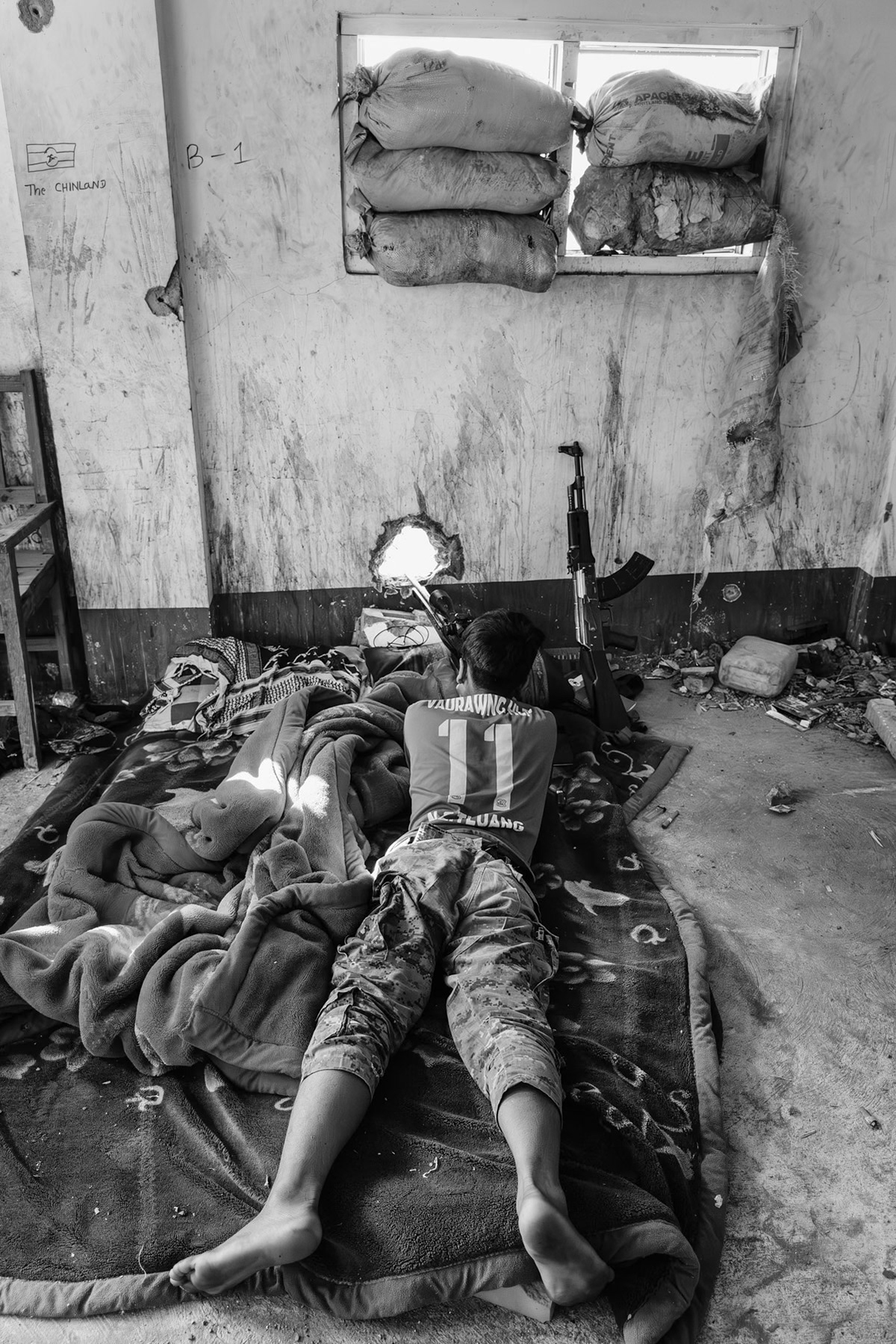 Chin Defense Forces (CDF) sniper positions on the frontline in the hospital building. Merely 200m separates their position from the Myanmar military posts. Thantlang hospital, Chin State, Myanmar, April 2024