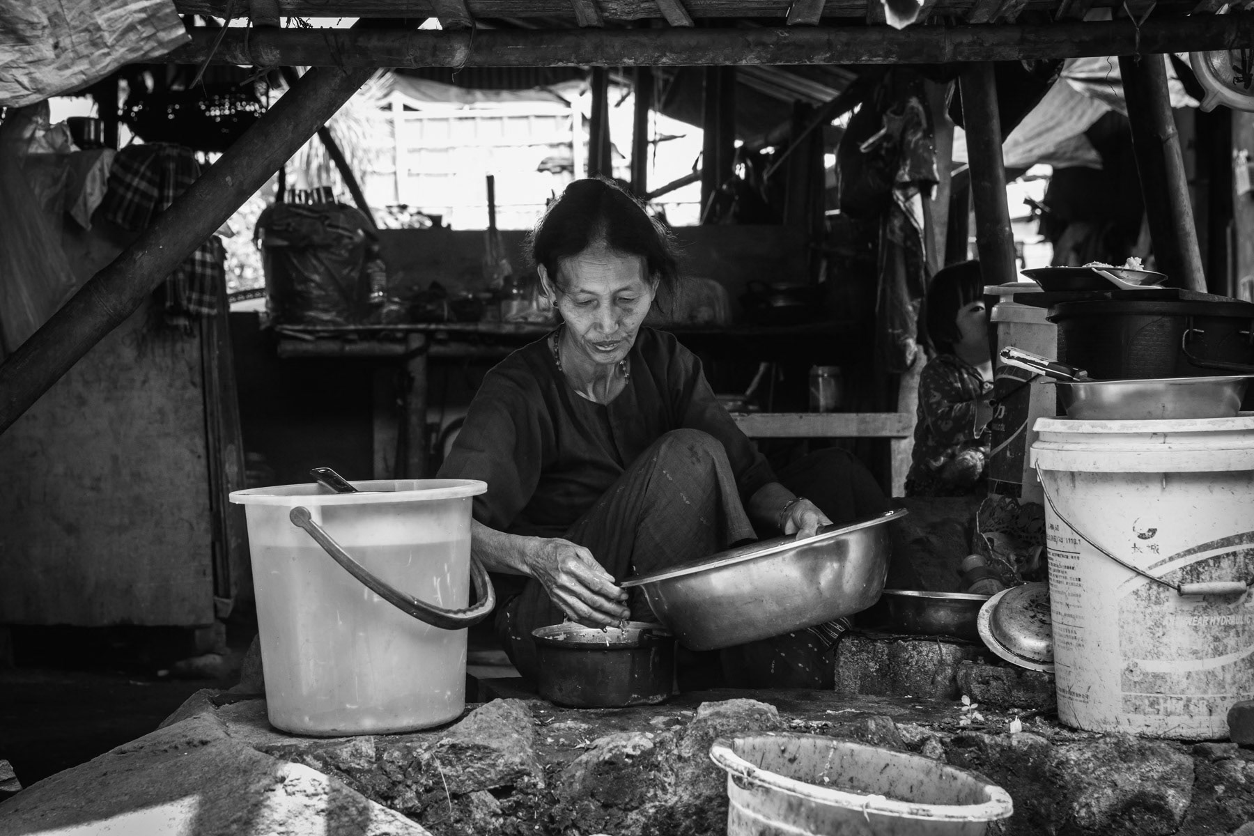 Elderly woman in an IDP camp along the border with China in Kachin Independence Army (KIA) held territory in Myanmar. More than 6000 displaced Kachin live in Woichyai camp near Laiza the stronghold of the KIA. Laiza, Myanmar, April 2019