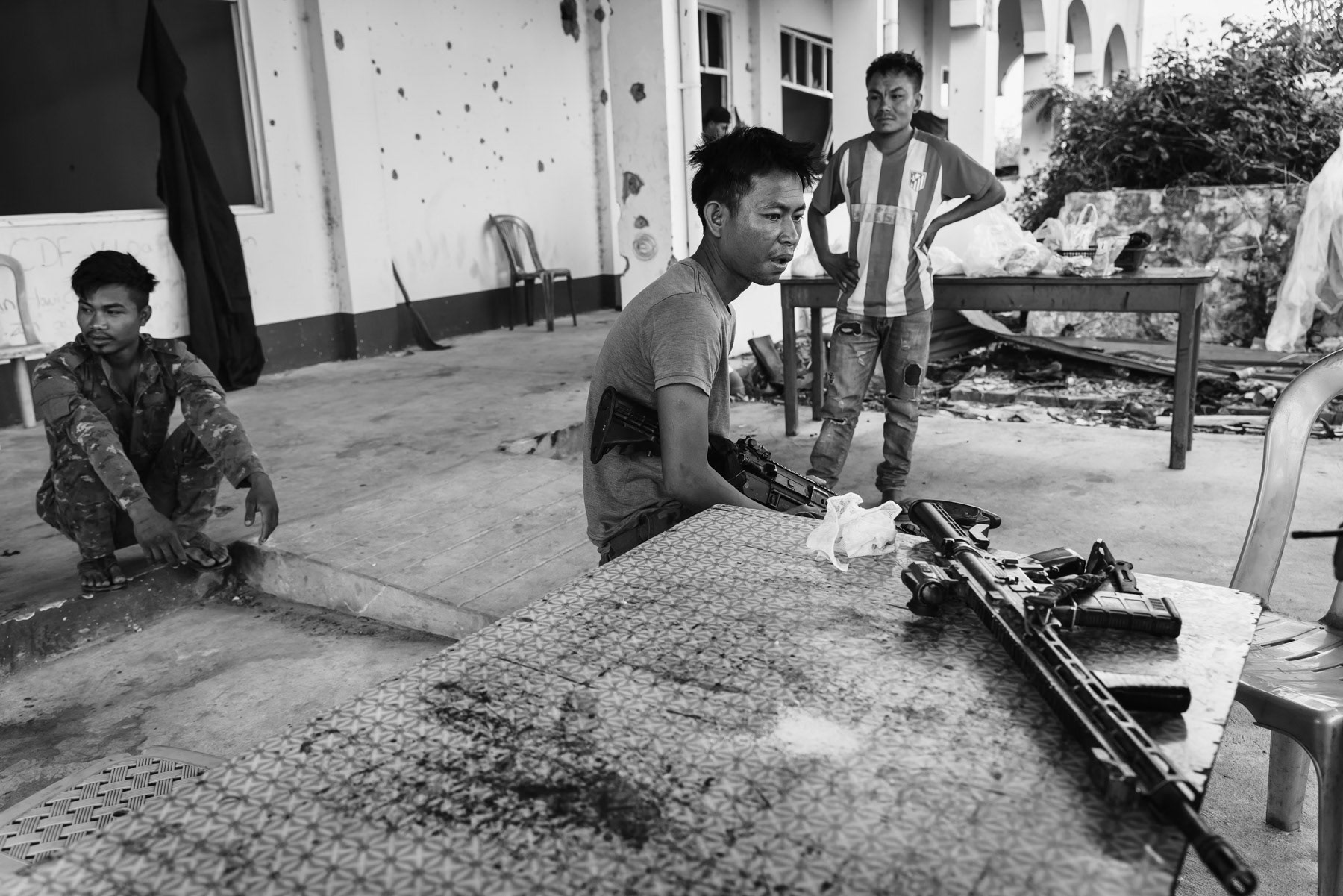 Resistance fighters of the Chin Defense Forces in charge of holding the hospital buiding facing the ennemy positions. Thantlang hospital, Chin State, Myanmar, April 2024