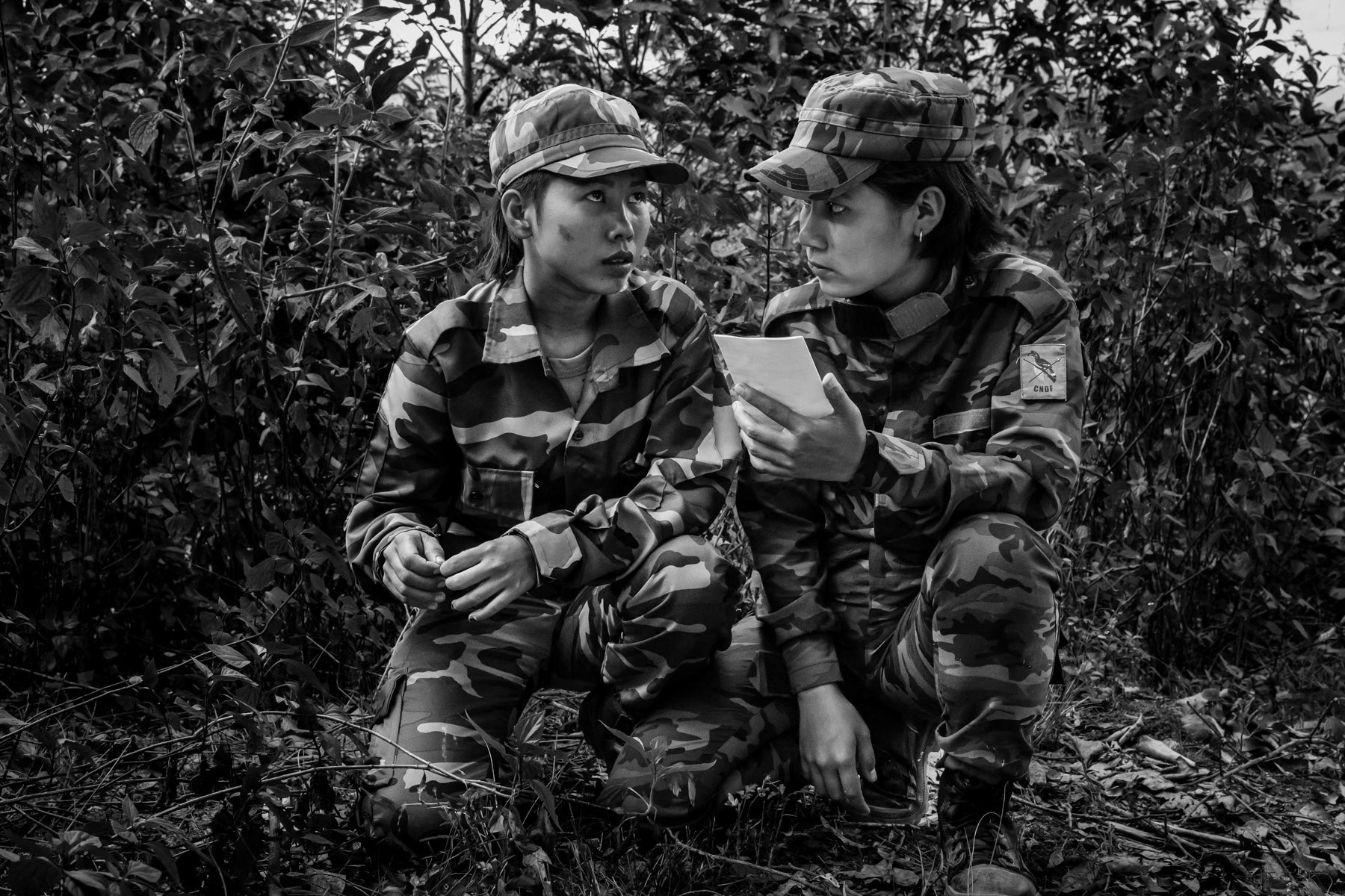 Women part of the Chin National Defence Forces manning an observation post on the frontline. Since the military coup in Myanmar, young women and men have taken up arms throughout the country to resist and defend themselves against atrocities committed by Tatmadaw, the Myanmar military who supressed civilian rule in February 2021. Falam township, Chin State, Myanmar, November 2022