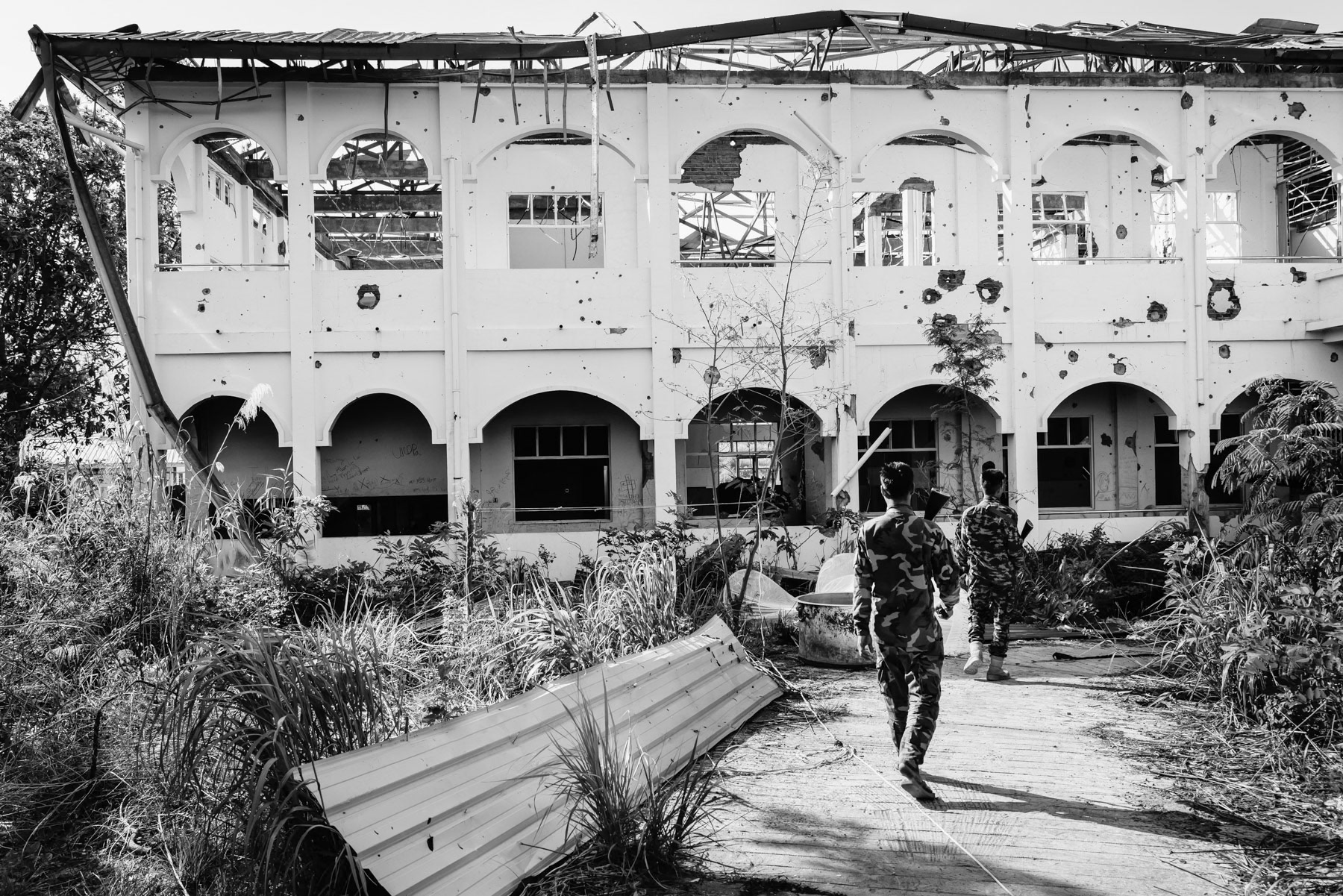 Hospital building of Thantlang after having been repeatedly shelled by the Myanmar military position just a couple of hundred meteres away. Thantlang hospital, Chin State, Myanmar, April 2024