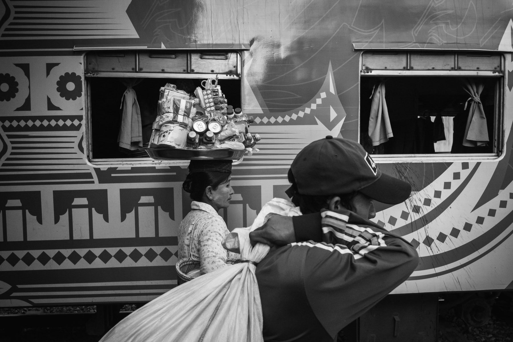 Travellers and sellers at Myitkyina train station, the last stop on the Yangon-Mandalay-Myitkyina line after a 36-40 hours journey. Myitkyina in Kachin State, Myanmar, March 2019