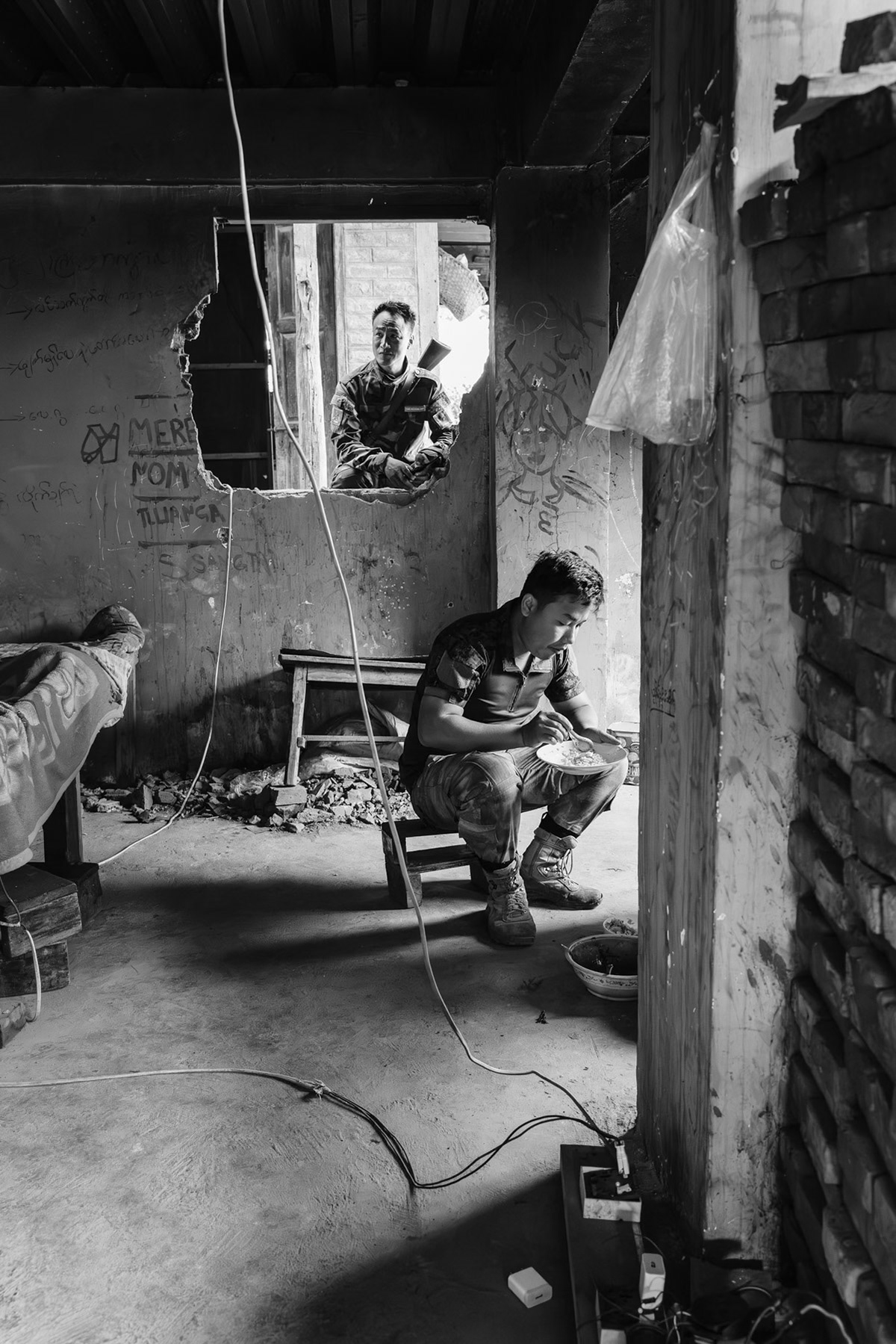 Members of the Chin Defense Forces at the frontline in a school facing the Myanmar military positions. The town has been emptied of its civilian population and is since then bitterly fought over. At this stage both sides control more or less 50% of Thantlang. Thantlang school building, Chin State, Myanmar, April 2024