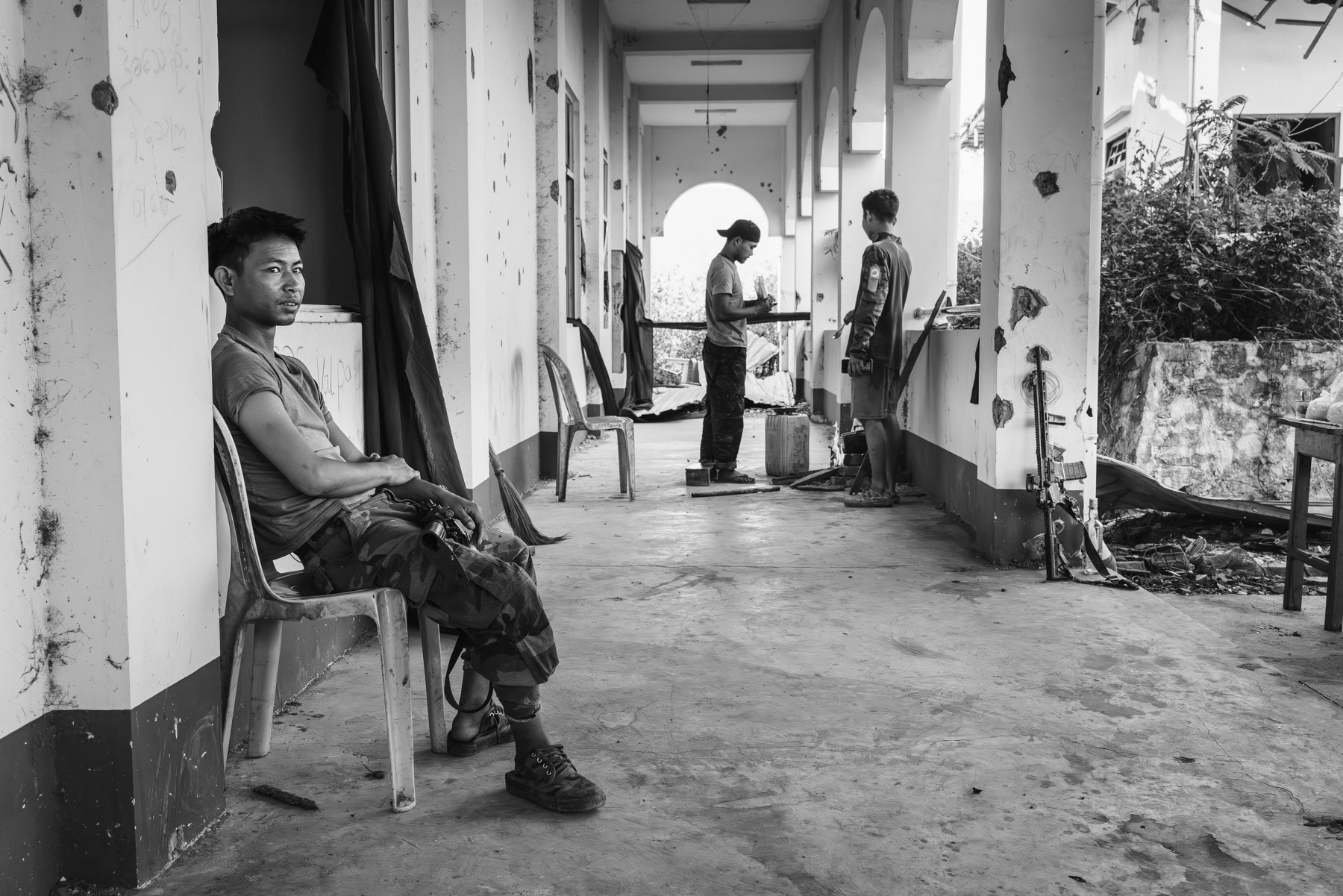 Resistance fighters of the Chin Defense Forces in charge of holding the hospital buiding facing the ennemy positions. Thantlang hospital, Chin State, Myanmar, April 2024