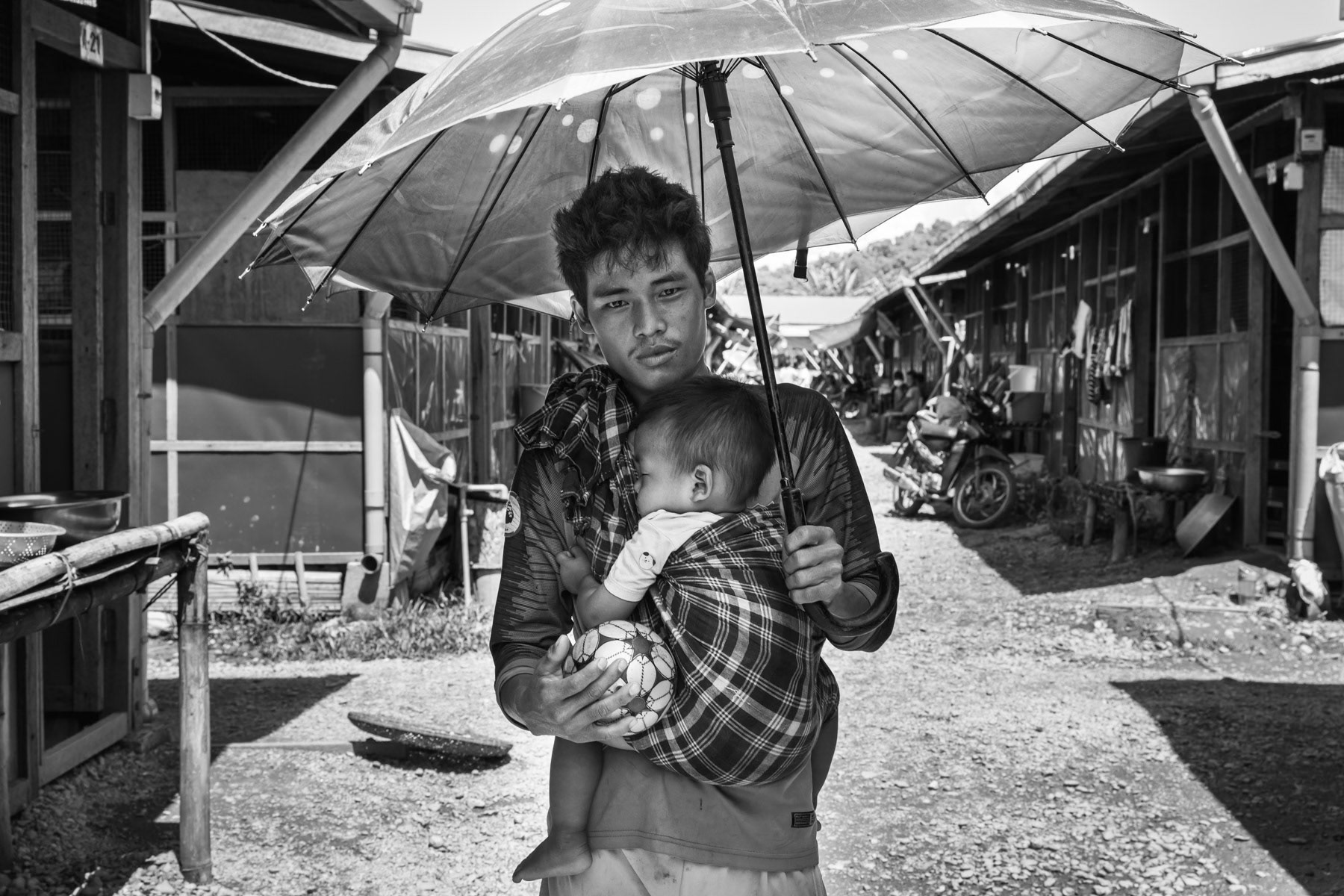 Father and his one year old son in Lambraw IDP camp where 557 people live since April 2018 after being displaced from their village 25 Km away. Namta, Kachin, Myanmar, September 2019