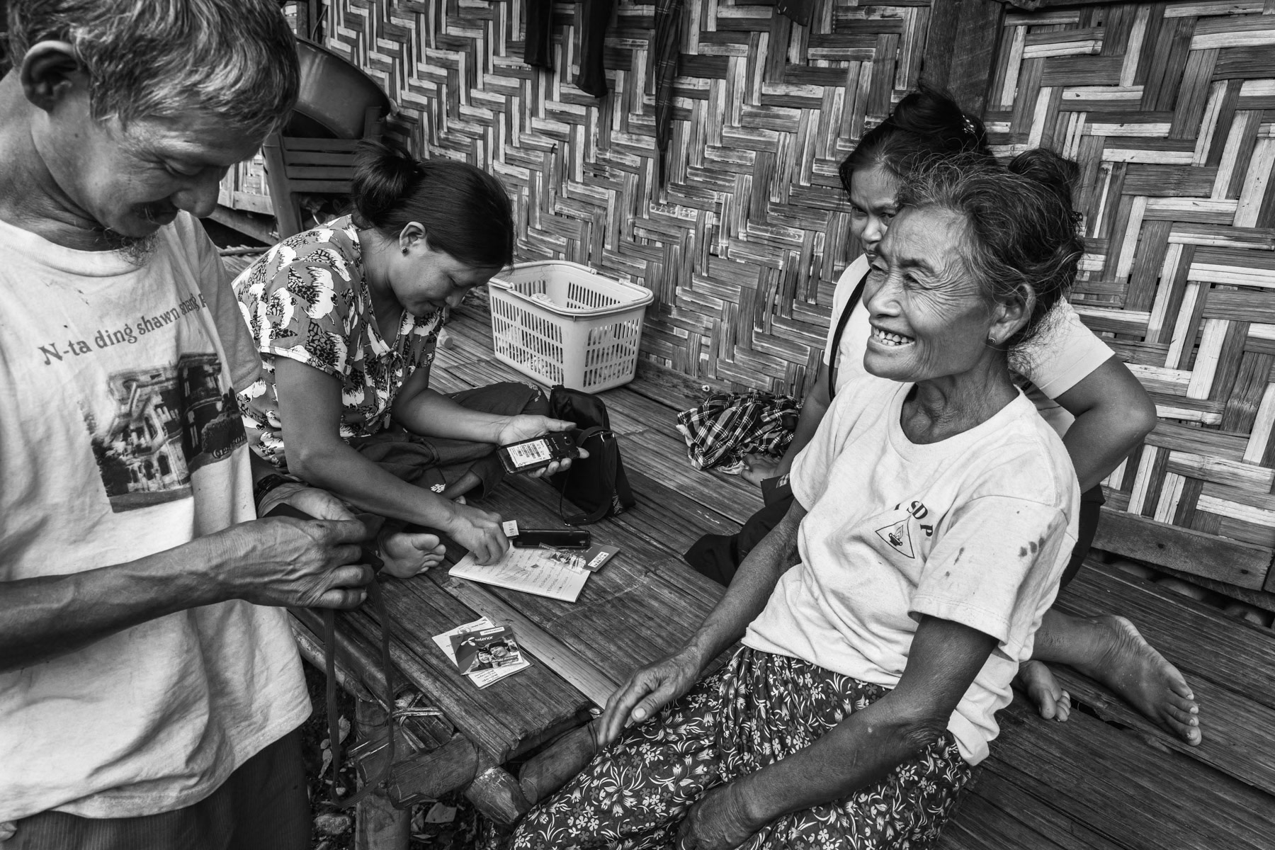 Distribution of SIM card for cash payments via mobile operator, organised by WFP and replacing food distributions. Maina IDP camp, Waimaw, Kachin State, Myanmar, September 2019