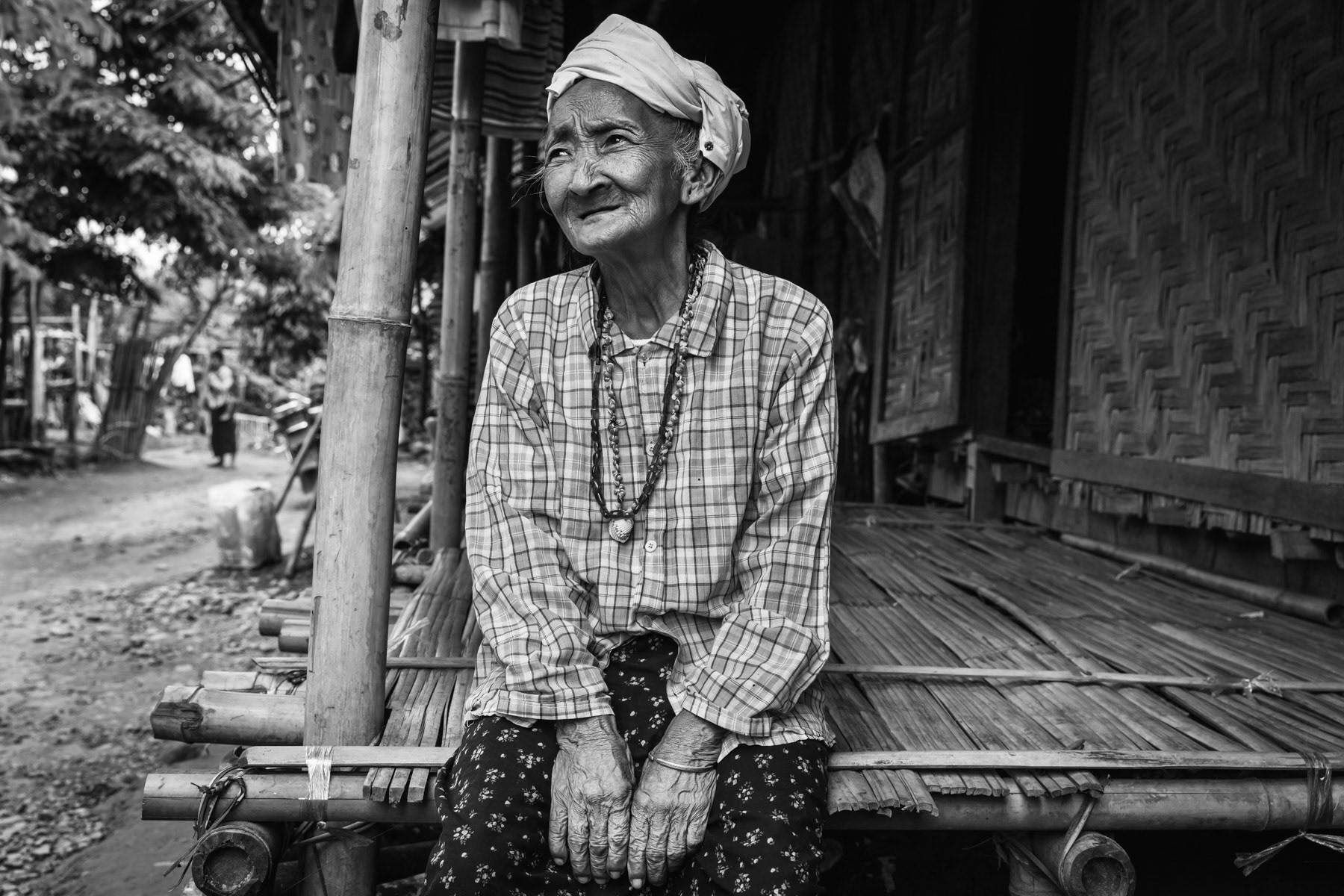 Elderly Kachin woman of 78 years who still has trauma of when she had to flee her village because of heavy artillary in 2011. She was recently treated for TB. The living conditions in the IDP camps are extremely precarious and are in particular a harsh environment for children and elderly. Maina IDP Camp, Waimaw, Kachin State, Burma, September 2019