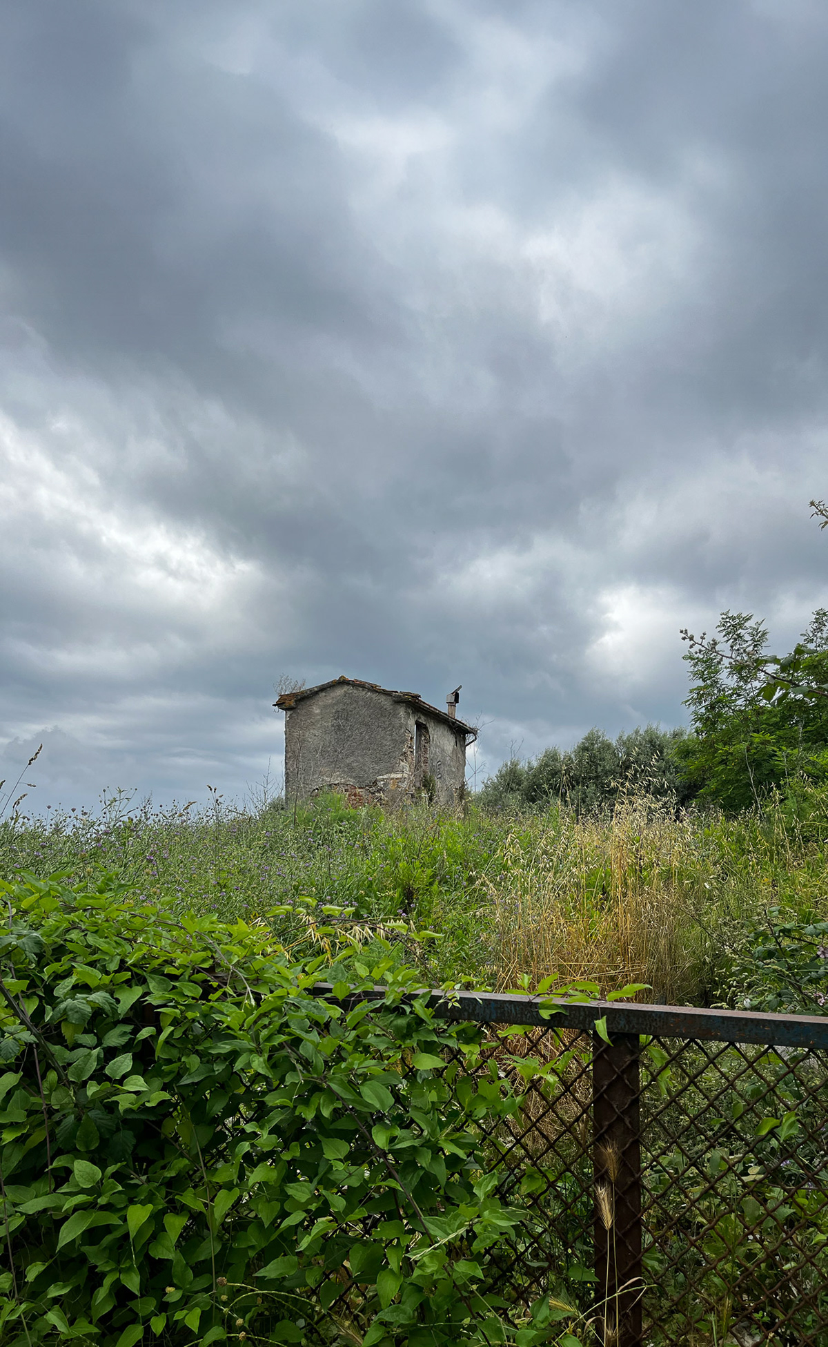 Old abandoned house in a country with cloudy dramatic sky