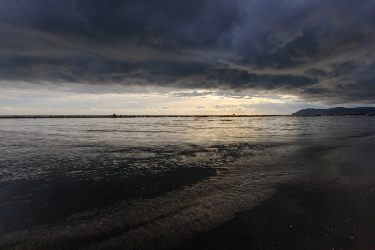 Seascape in the sunset and cloudy sky