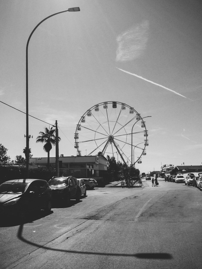 Big wheel on the seaboard in Marina di Massa, Italy (black and white)